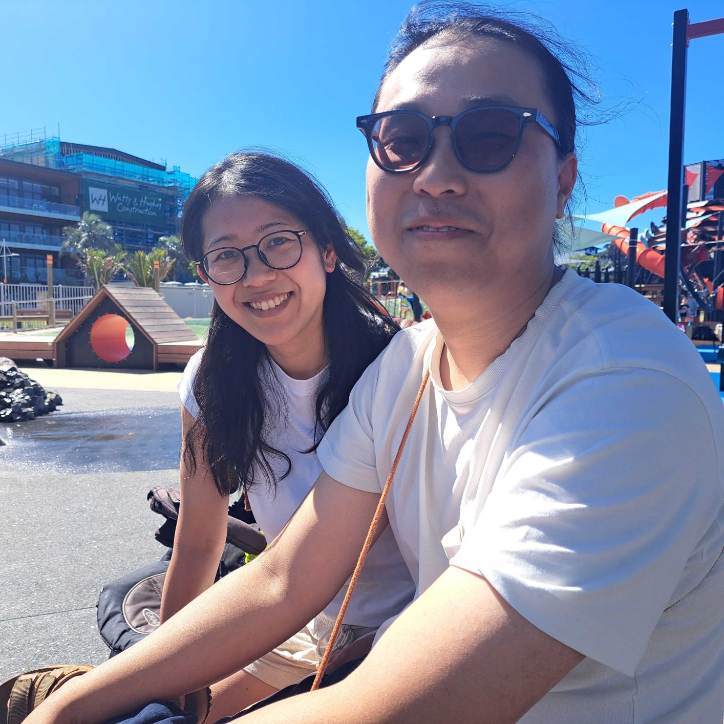 Rikarika Sushi Express owners Brian Kim and his wife Rika (left) taking a wee break from their Grey St cafe down on the Tauranga waterfront with their two children on December 28. Photo / Sandra Conchie