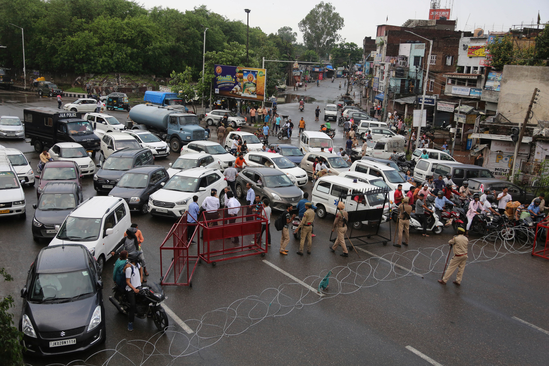 Barricades are set up by Indian police to prevent the moment of vehicles during curfew like restrictions in Jammu, India. Photo / AP