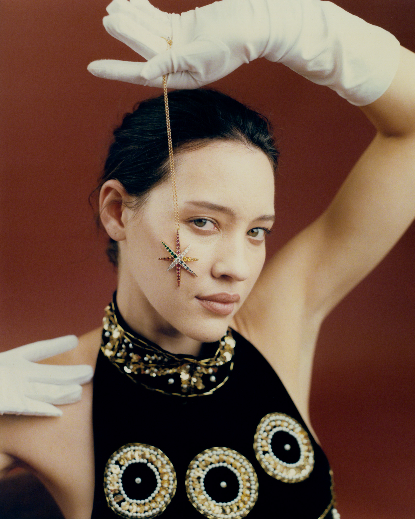 Fabienne wears vintage Adrienne Winkelmann gown, Cornelia James opera gloves and holds James McCarty pendant. Photo / Jerome Warburton