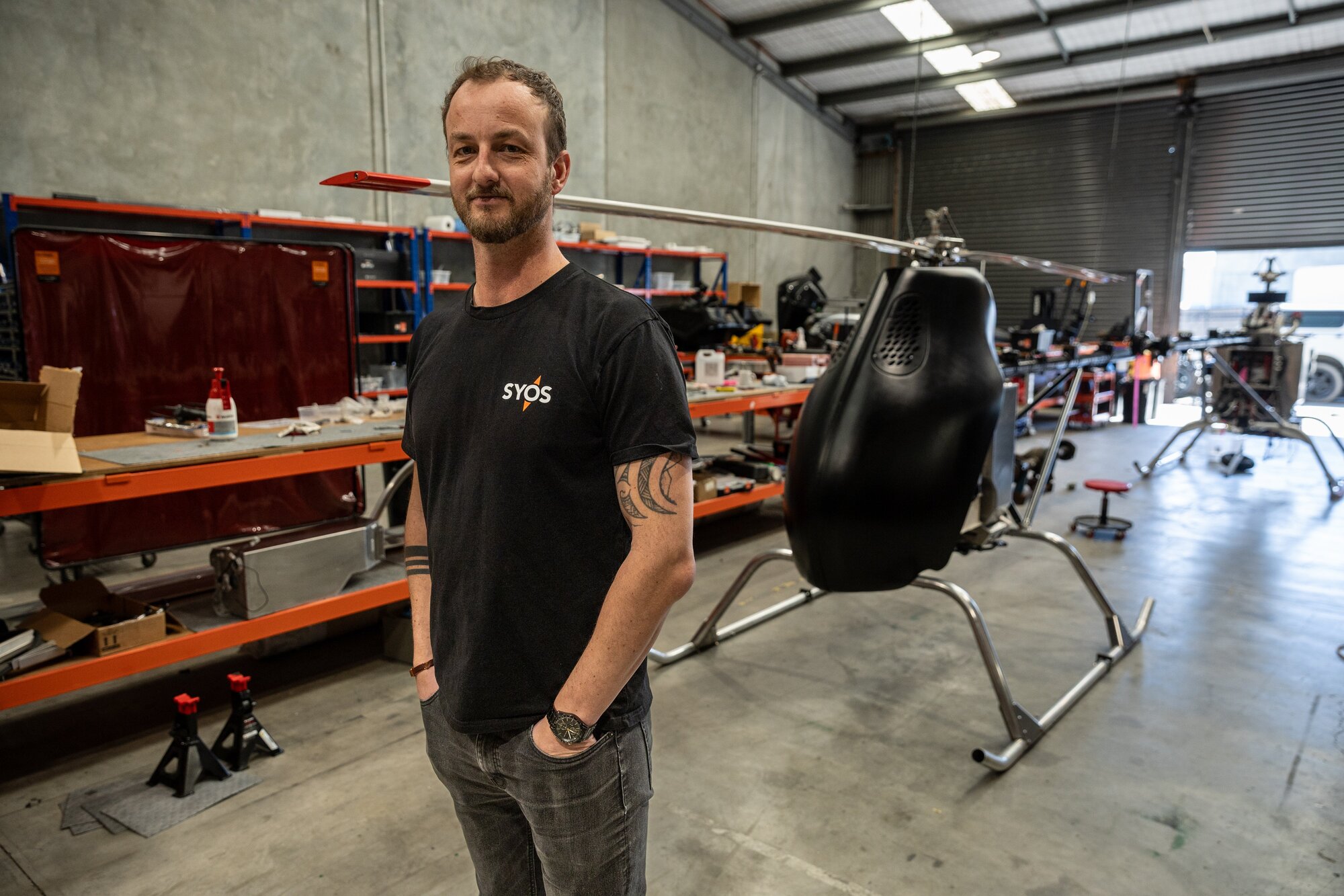 Syos Aerospace founder and CEO Sam Vye with his company's SA200 UAS (Uncrewed Aircraft System), designed for heavy lifting. Photo / Jason Dorday