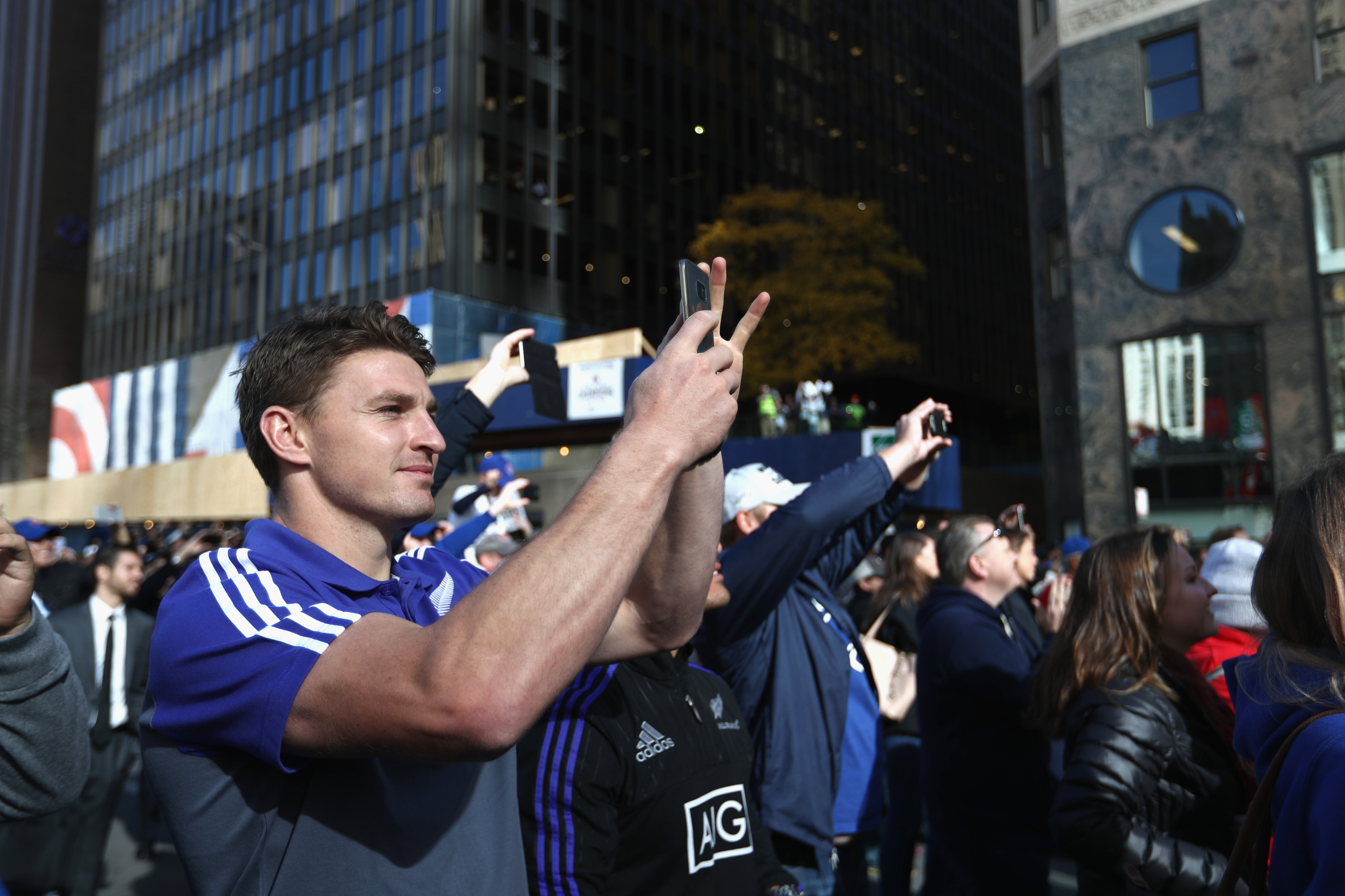 Beauden Barrett of the All Blacks watches the Chicago Cubs victory parade. Photo / Getty