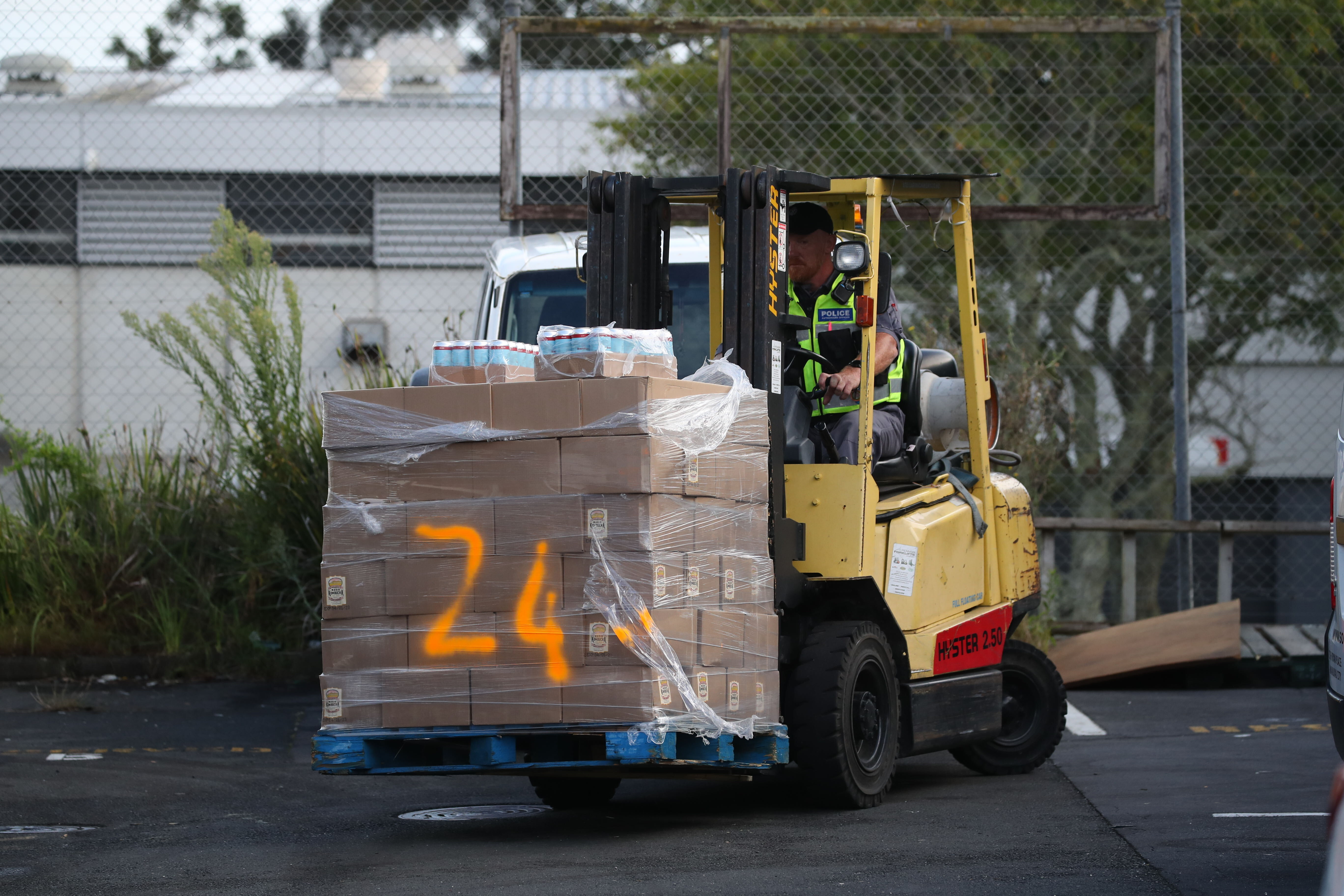 A large amount of beer cans possibly laced with meth are seized by police from a warehouse on Ryan Pl, Manukau. Photo / Jason Oxenham
