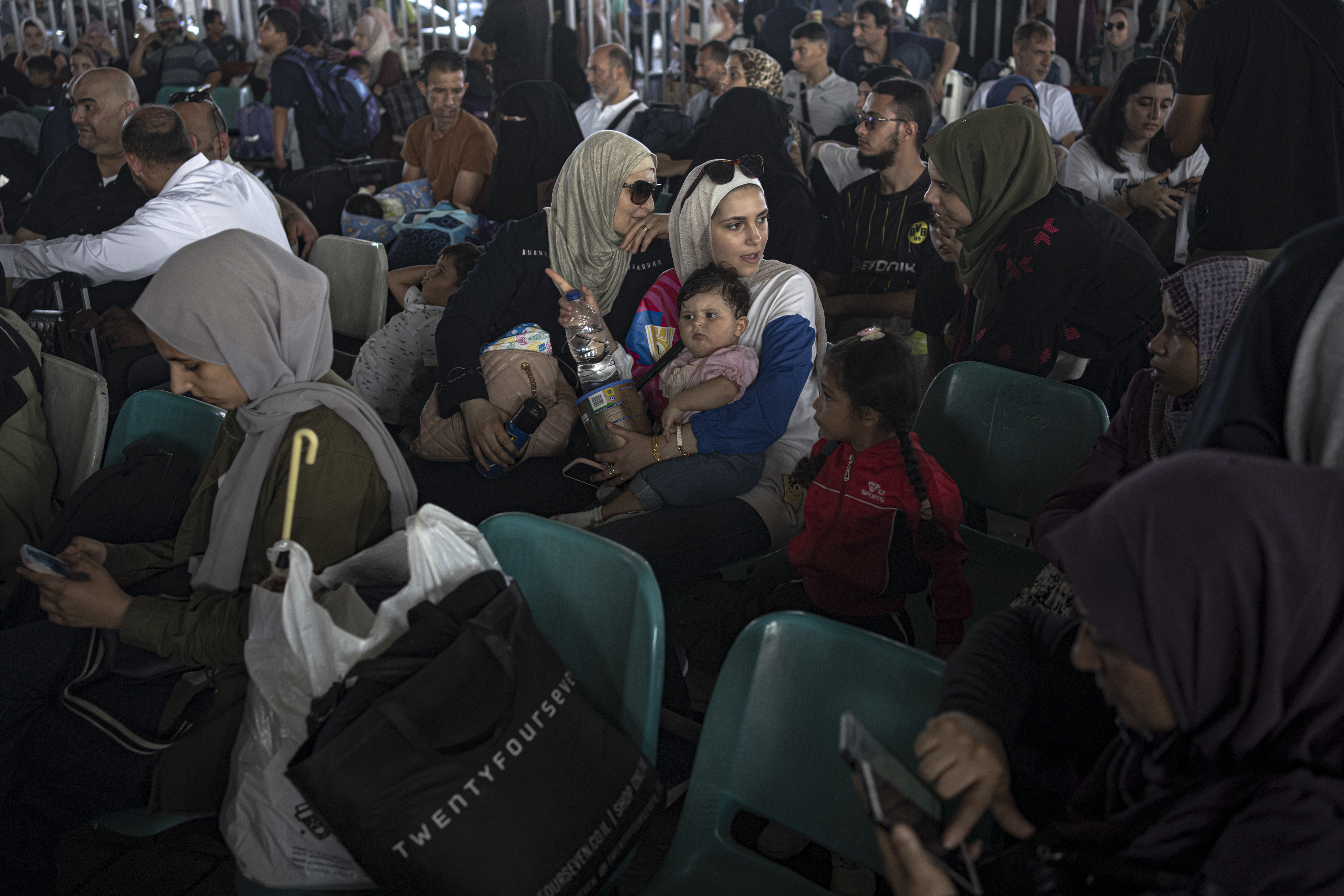 Palestinians wait to cross into Egypt at Rafah, Gaza Strip. Photo / AP