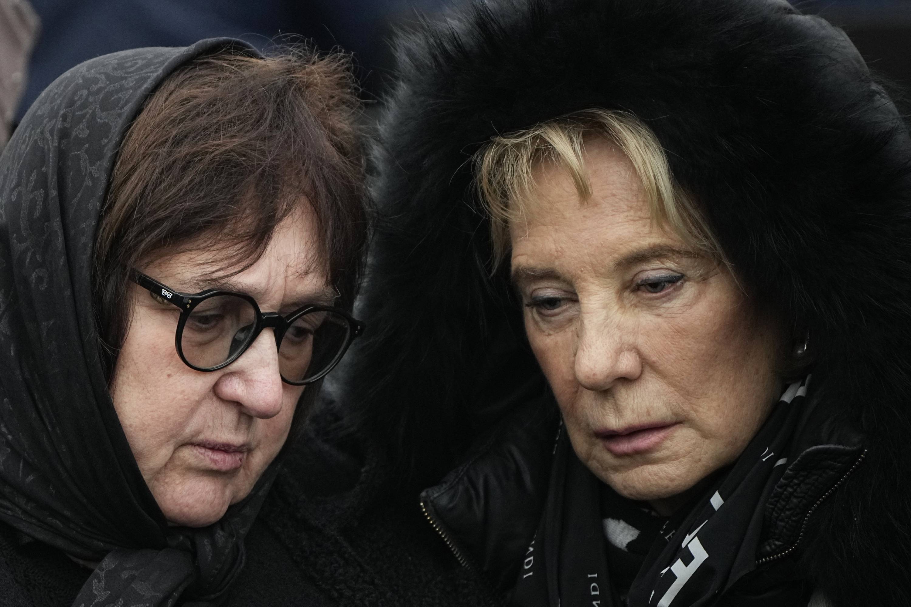 Alexei Navalny's mother, Lyudmila Navalnaya (left), and his mother-in-law pay their last respects to him. Photo / AP