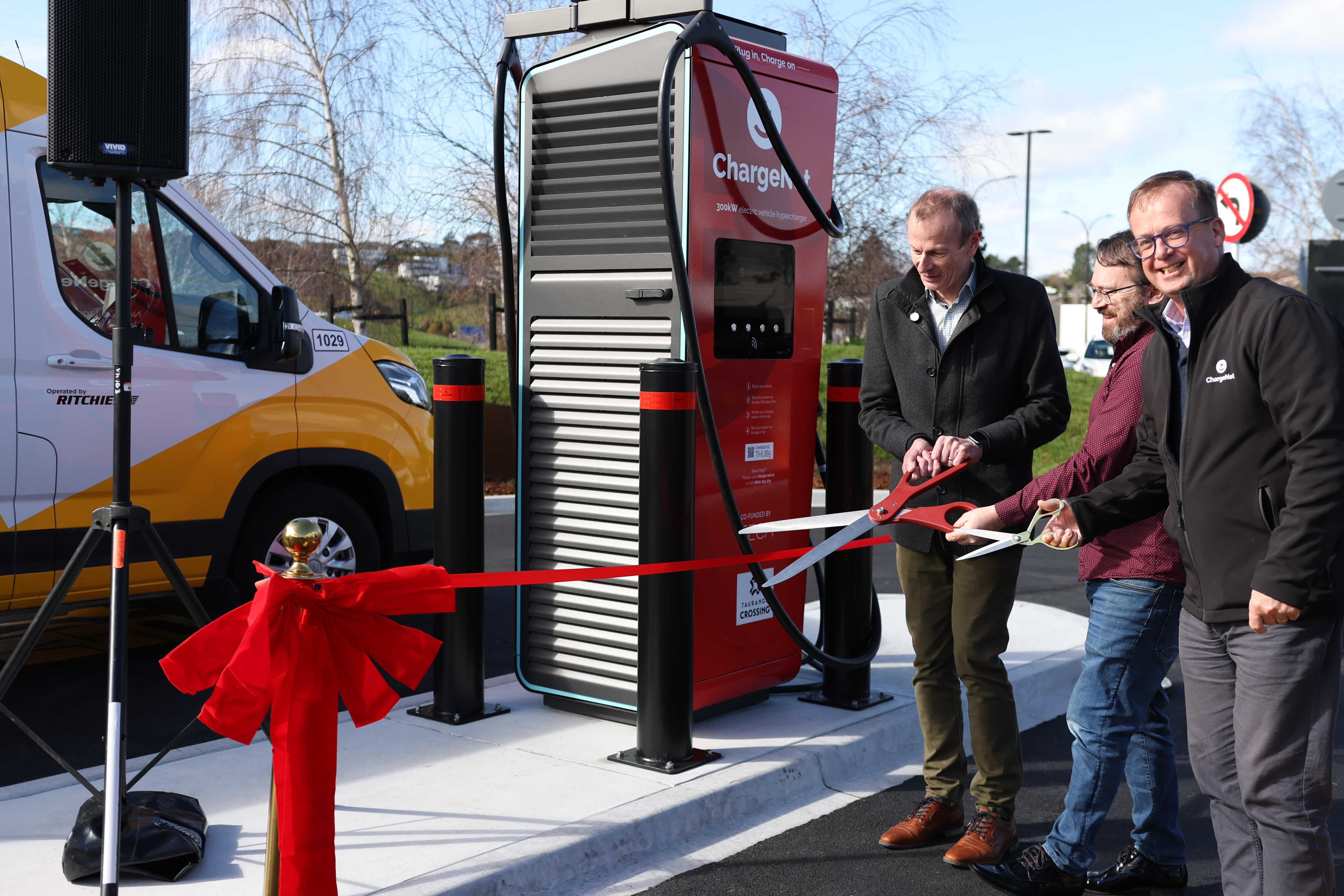 ChargeNet's new 10-charger hub at Tauranga Crossing is billed as the country's largest. From left at today's opening: Richard Briggs (EECA partnerships manager), Steve West (ChargeNet cofounder), Julian McCree (ChargeNet board member).