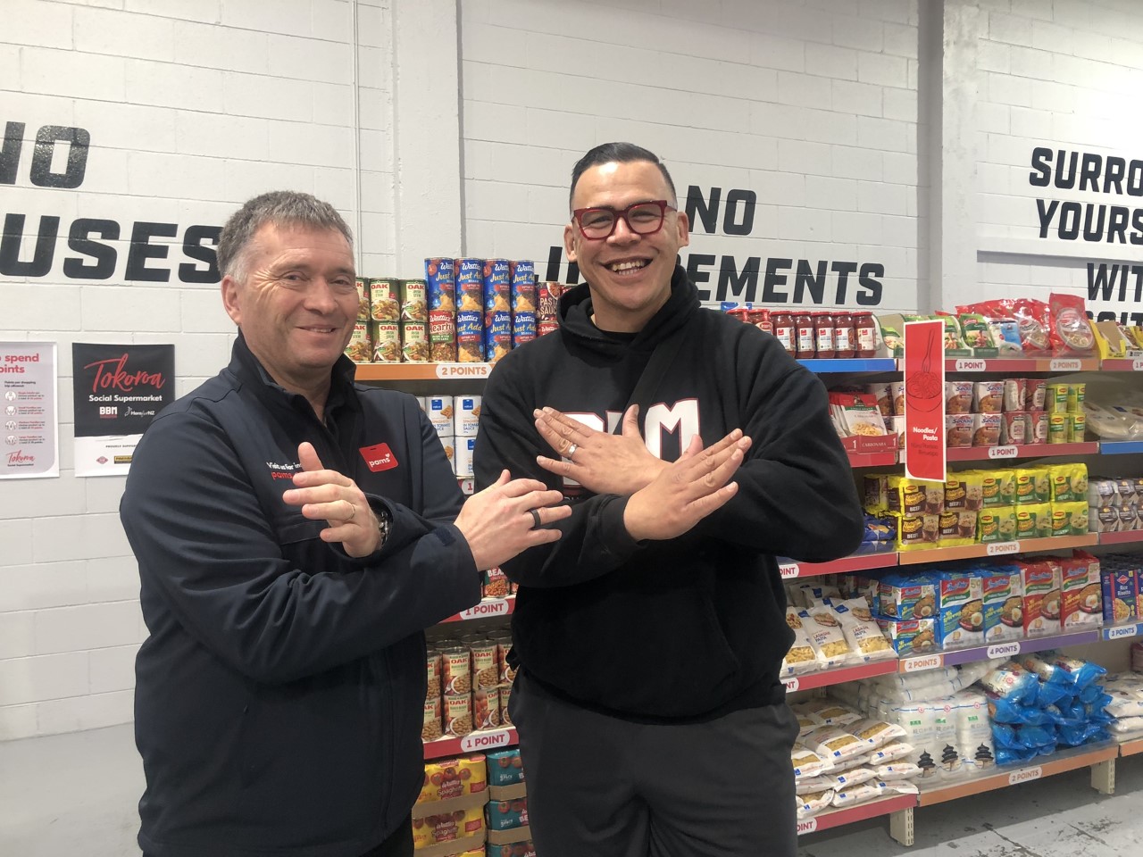 Foodstuffs North Island chief executive Chris Quin (left) and Dave Letele of Buttabean Motivation at the Tokoroa Social Supermarket. Photo / Supplied