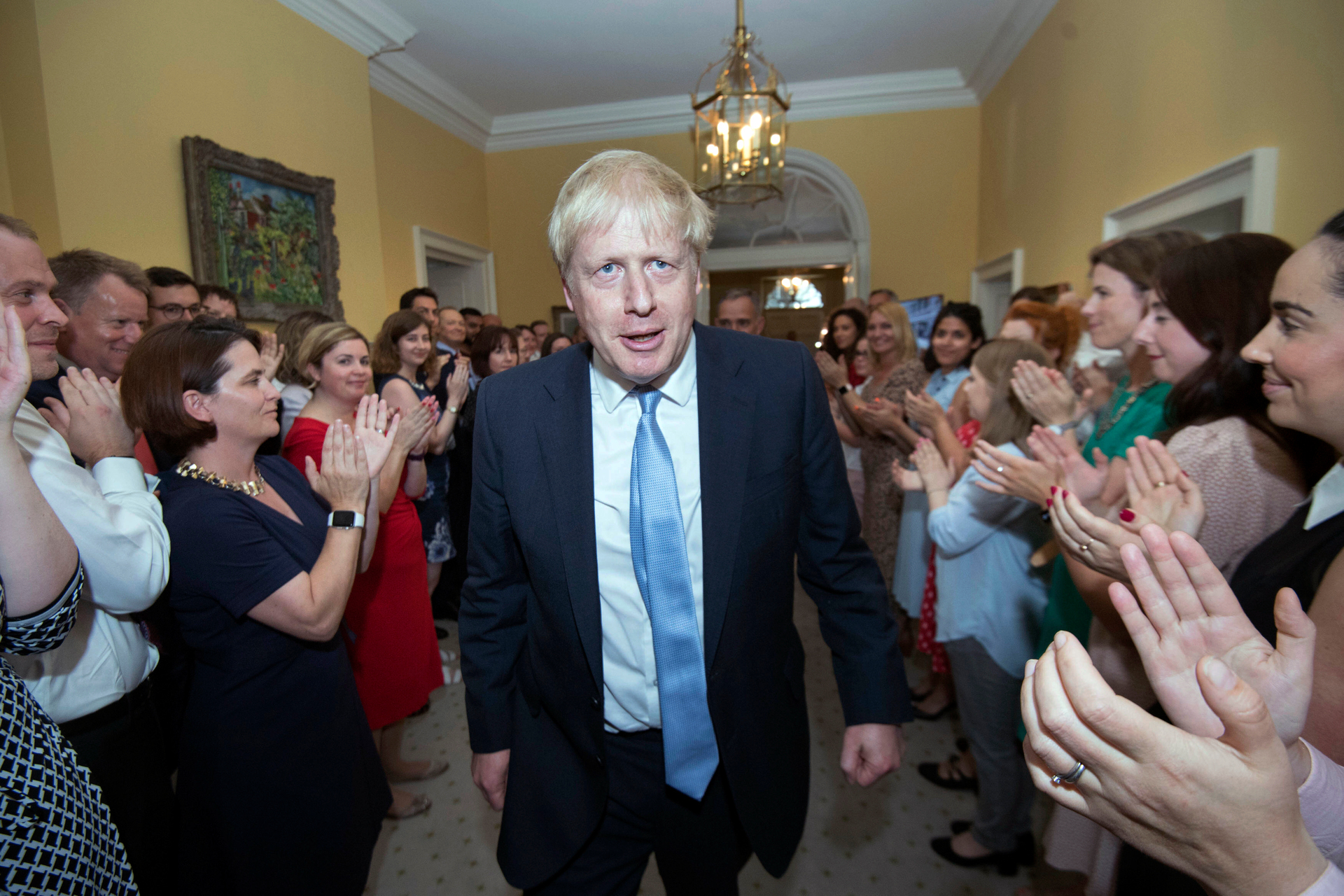 Britain's New Prime Minister Boris Johnson is welcomed into 10 Downing Street by staff. Photo / AP