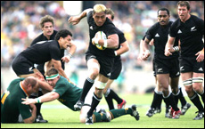 All Black Jerry Collins on the burst away from the Springbok defence of Os du Randt and John Smit. Ross Land / Getty Images