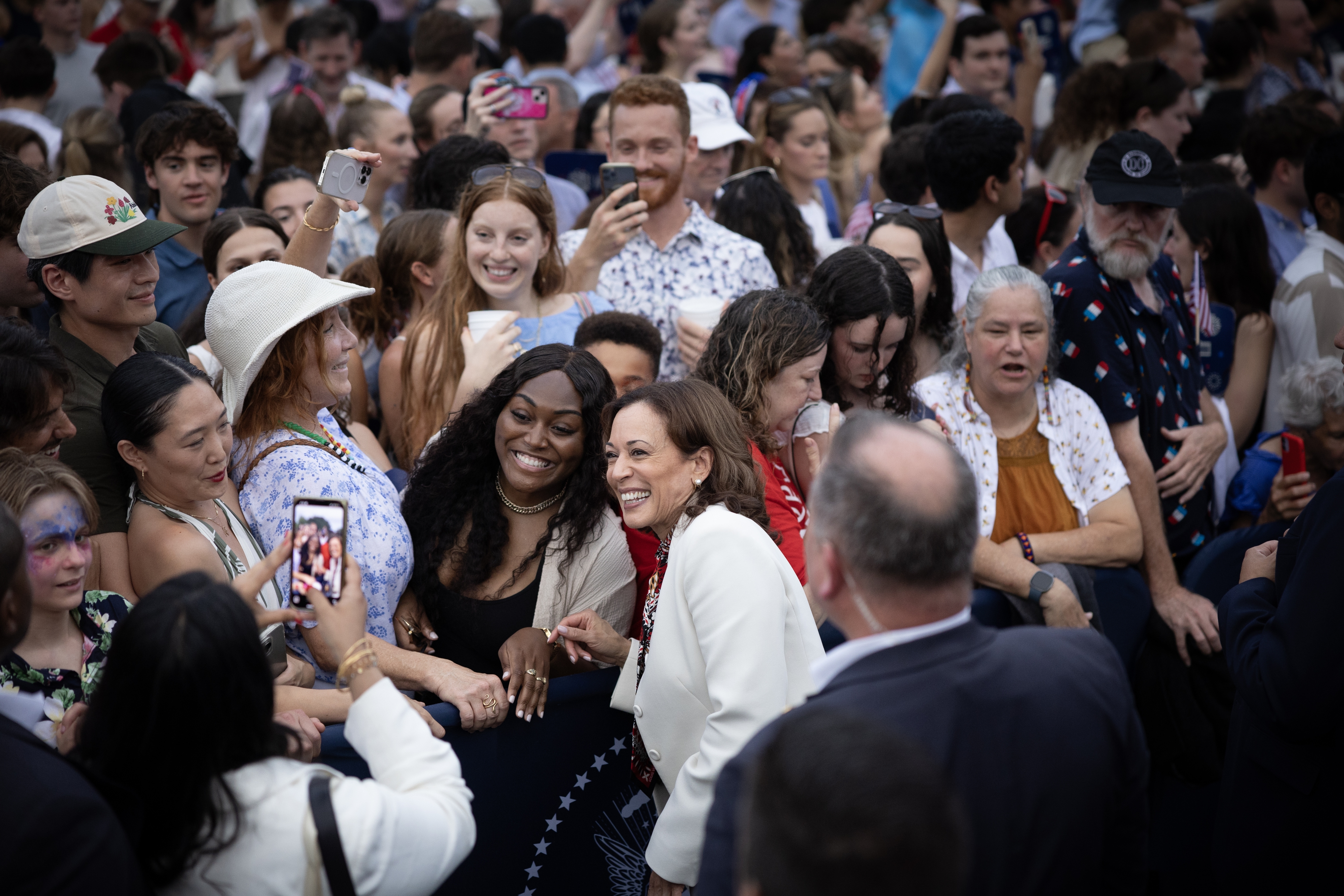 US Vice-President Kamala Harris takes selfies with audience members during an Independence Day celebration at the White House on July 4. Photo / Washington Post