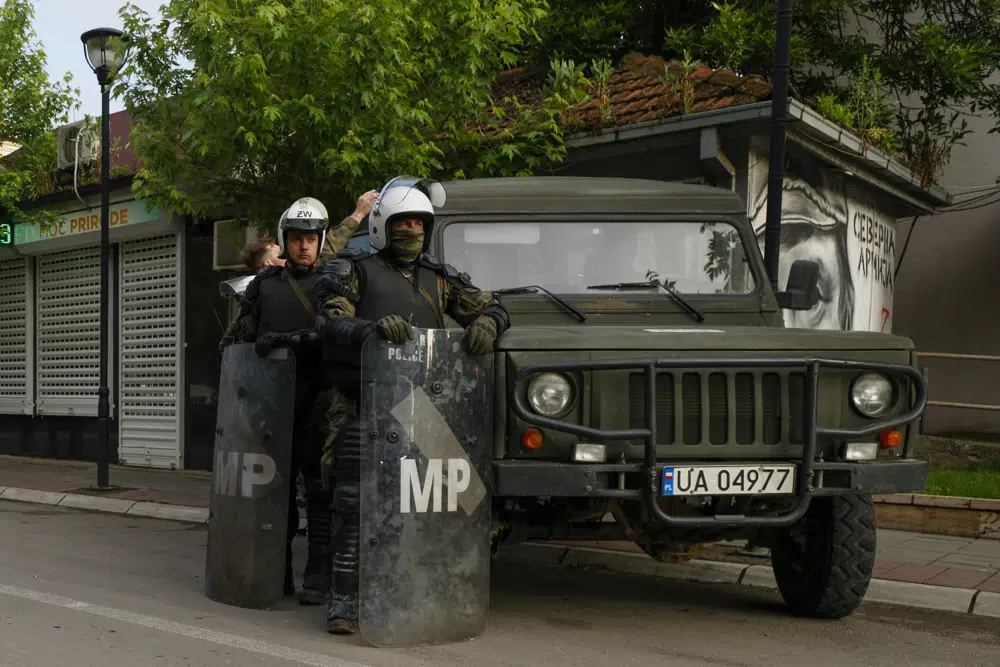 Polish soldiers, part of the peacekeeping mission in Kosovo KFOR guard street after Friday's violent clashes between Kosovo police and ethnic Serbs. Photo / AP