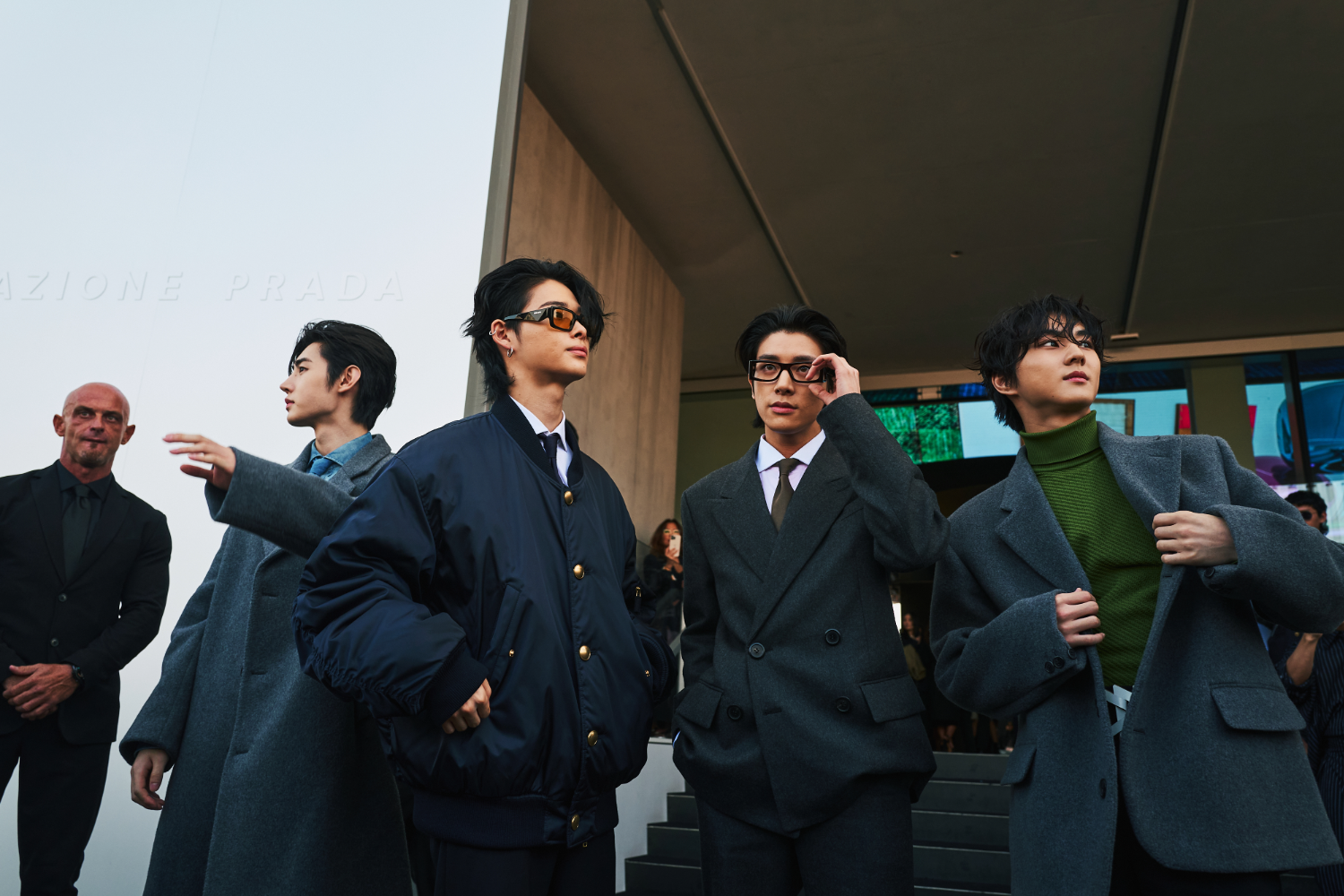 Members of the K-pop group Enhypen, in dark wools and ties, evoking autumnal Ivy League style. Photo / Simbarashe Cha for The New York Times