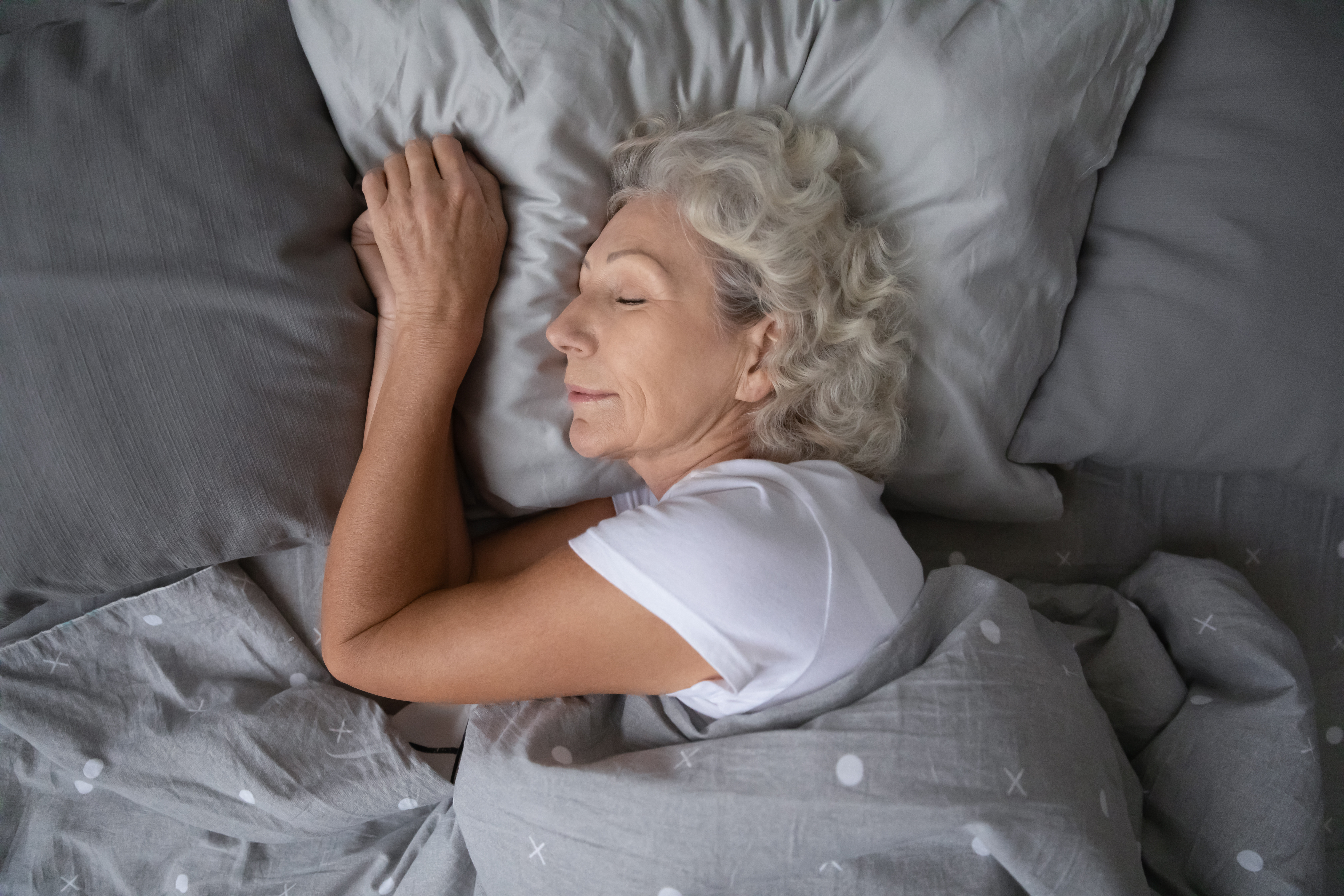 How to break the insomnia cycle, mitigate health risks, and reclaim rejuvenating sleep amidst night sweats and restless legs. Photo / 123rf