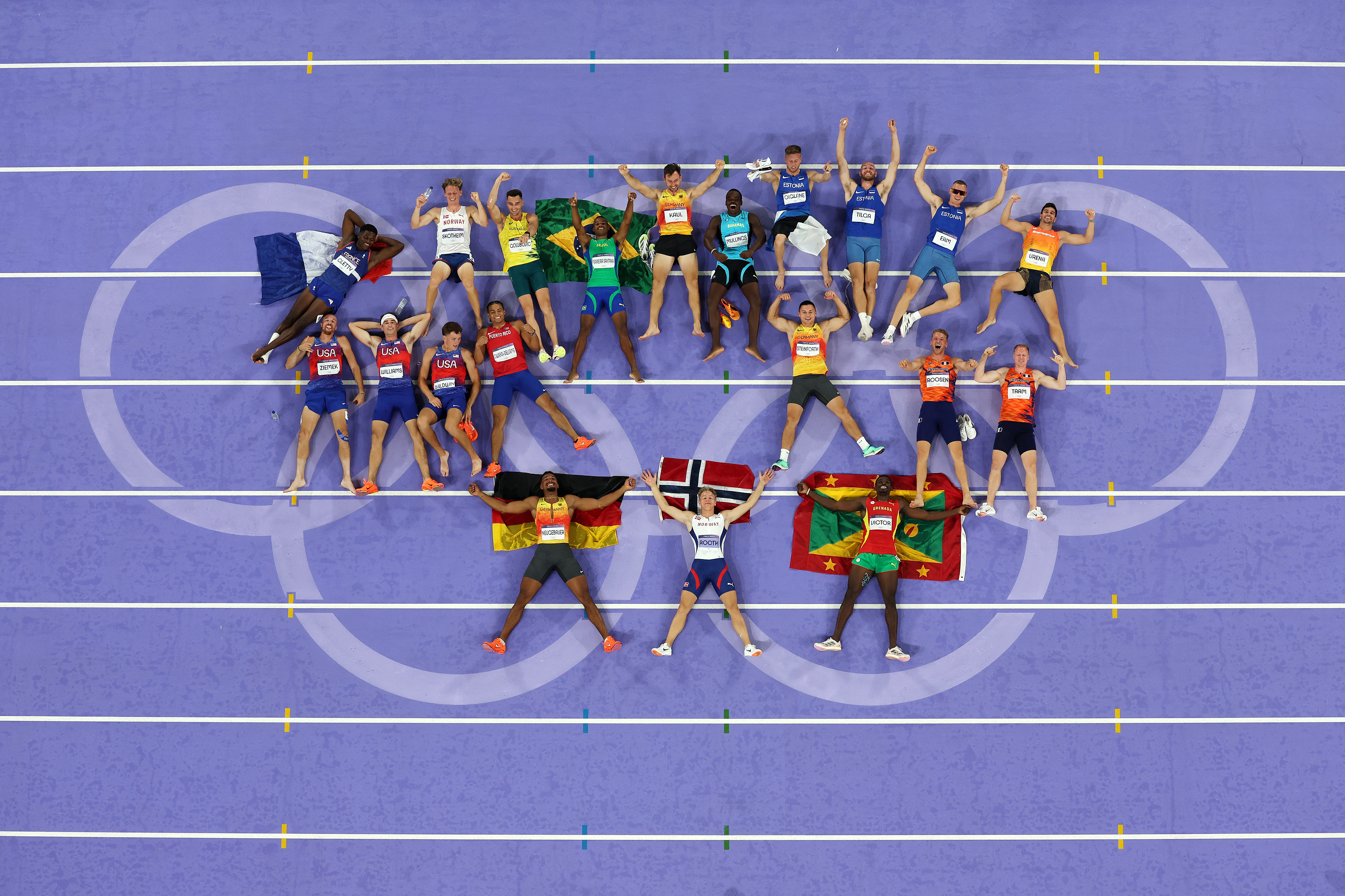 PARIS, FRANCE - AUGUST 03: Athletes of decathlon pose for a photo for an aerial shot on day eight of the Olympic Games Paris 2024 at Stade de France on August 03, 2024 in Paris, France. (Photo by Richard Heathcote/Getty Images)