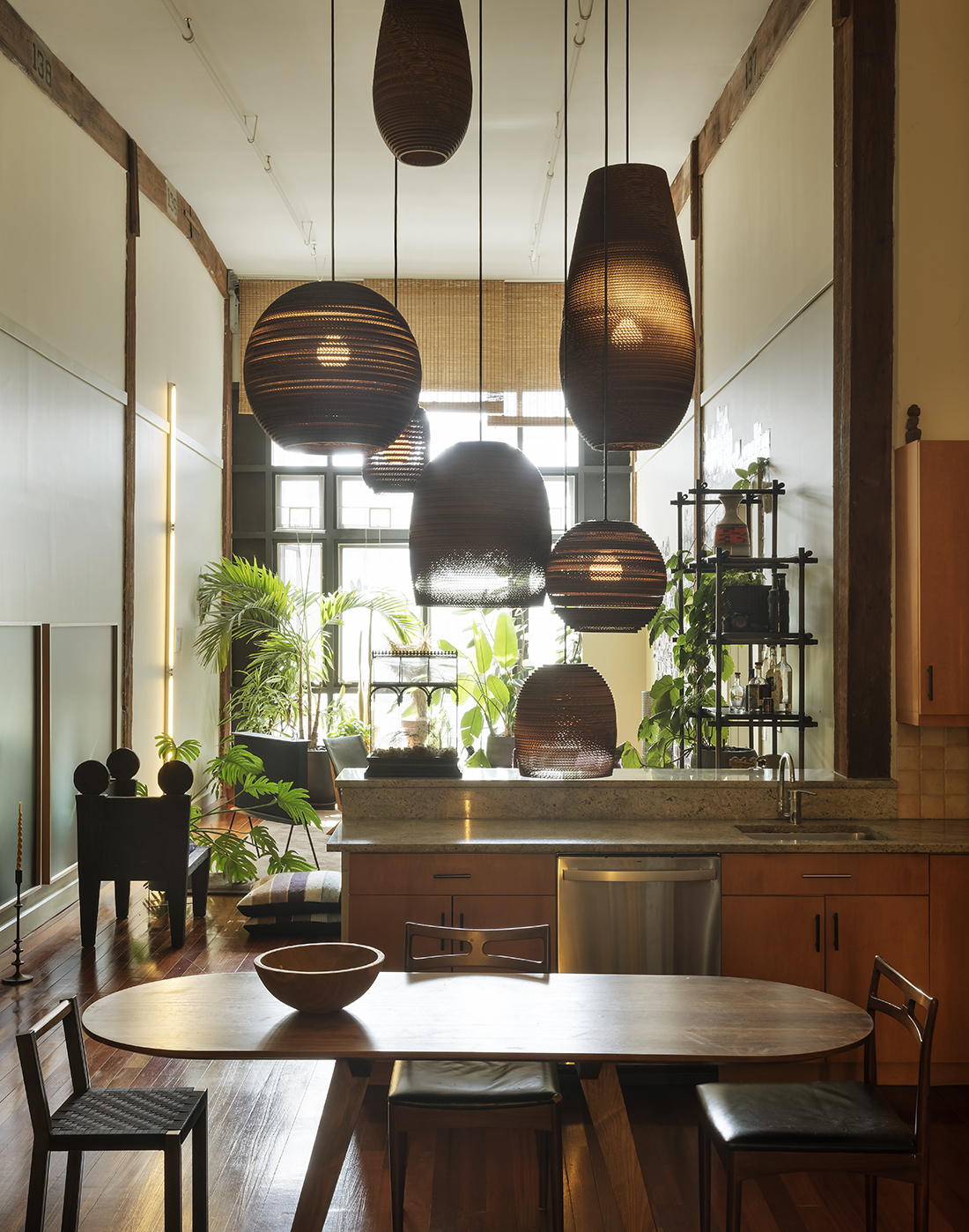 The apartment’s 6-metre-high studs offer ample opportunity to play with light fixtures. Photo / Matthew Williams