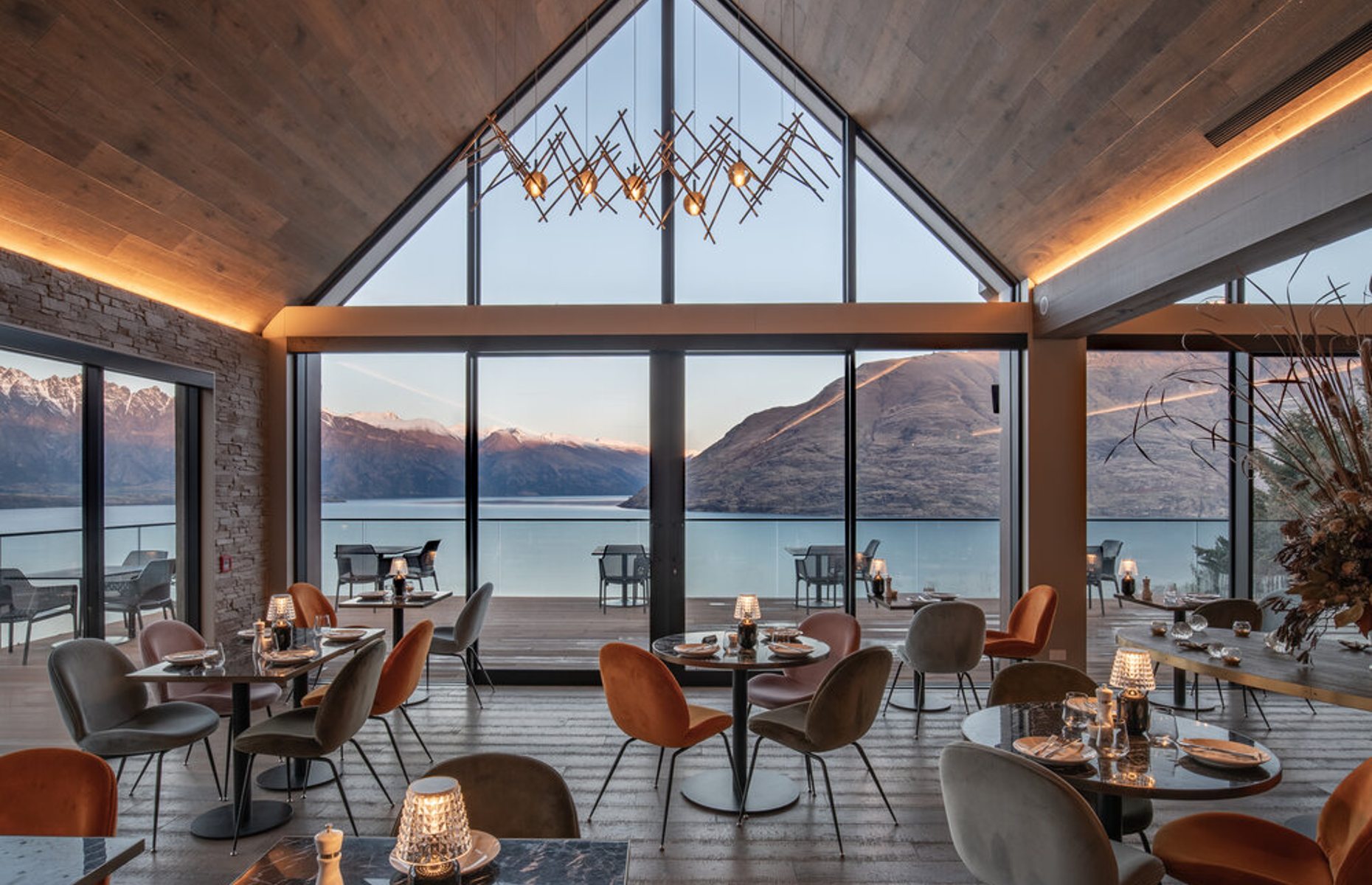 Enjoy innovative cocktails and fresh flavors at Nest, offering floor-to-ceiling views of the Remarkables from the shores of Lake Wakatipu. Photo / Nest