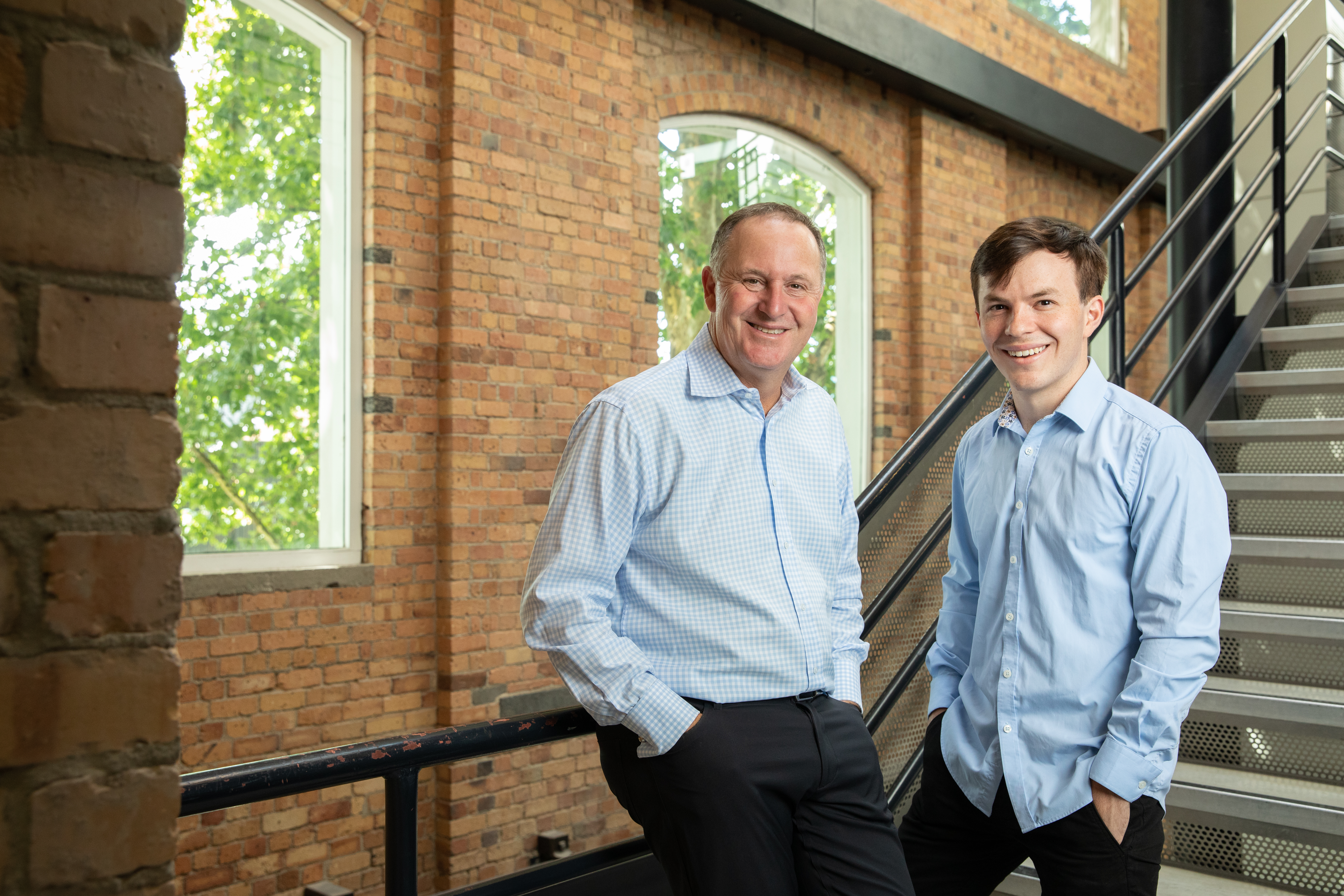 Former Prime Minister Sir John Key with Crimson Global Academy president Jamie Beaton.