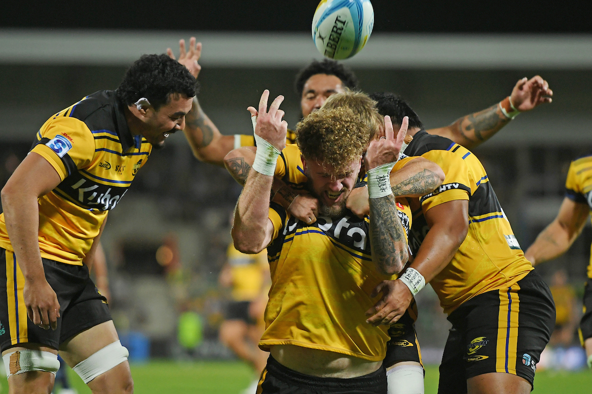 Hurricanes player Warner Dearns celebrates after he scored against the Force. Photo / Photosport