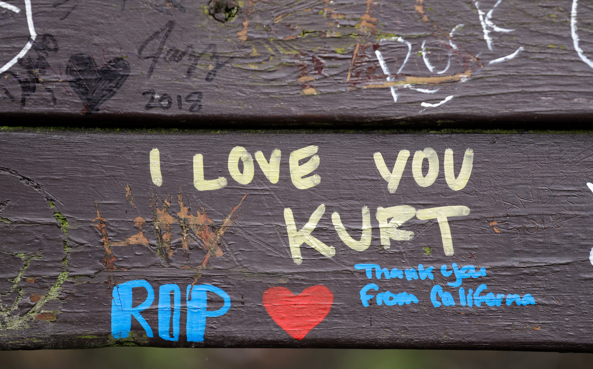 Messages honouring the late Nirvana frontman Kurt Cobain are written on a park bench near his home in Seattle. Photo / AP