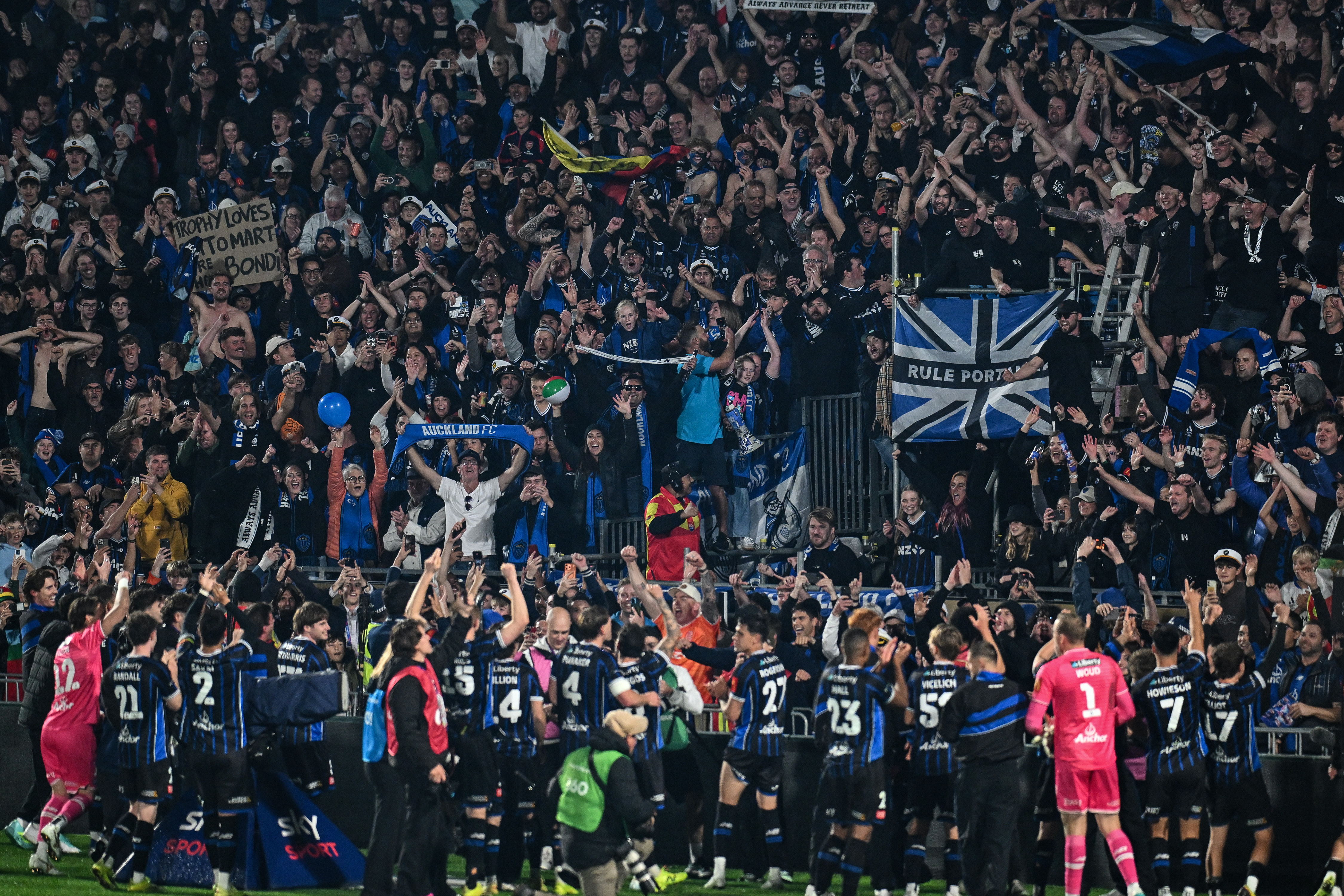 Auckland FC players celebrate with the fans. Photo / Photosport