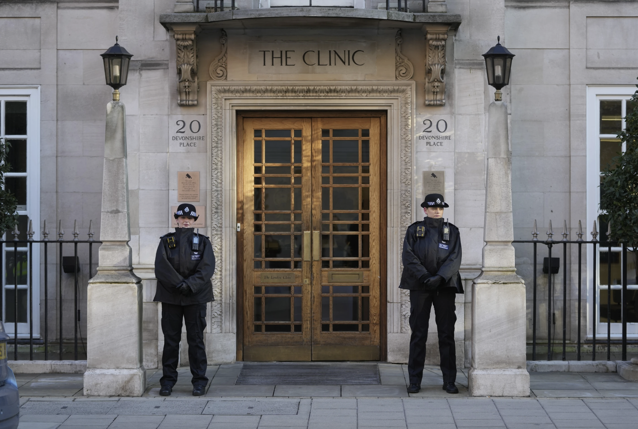 Policewomen stand guard outside the London Clinic where Kate, Princess of Wales, is recovering from surgery in London. Photo / AP