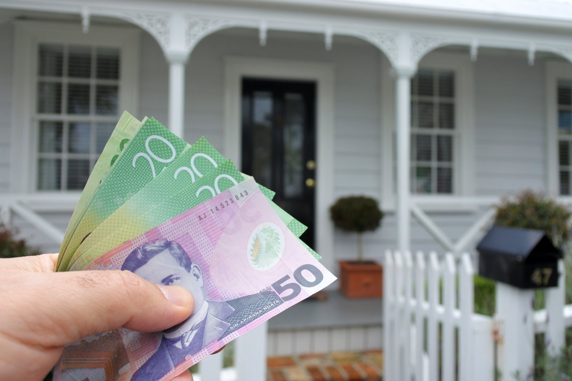 Flat house prices in some main centres may mean it's easier to buy your own home in New Zealand, than Australia, one expert says. Photo / NZME