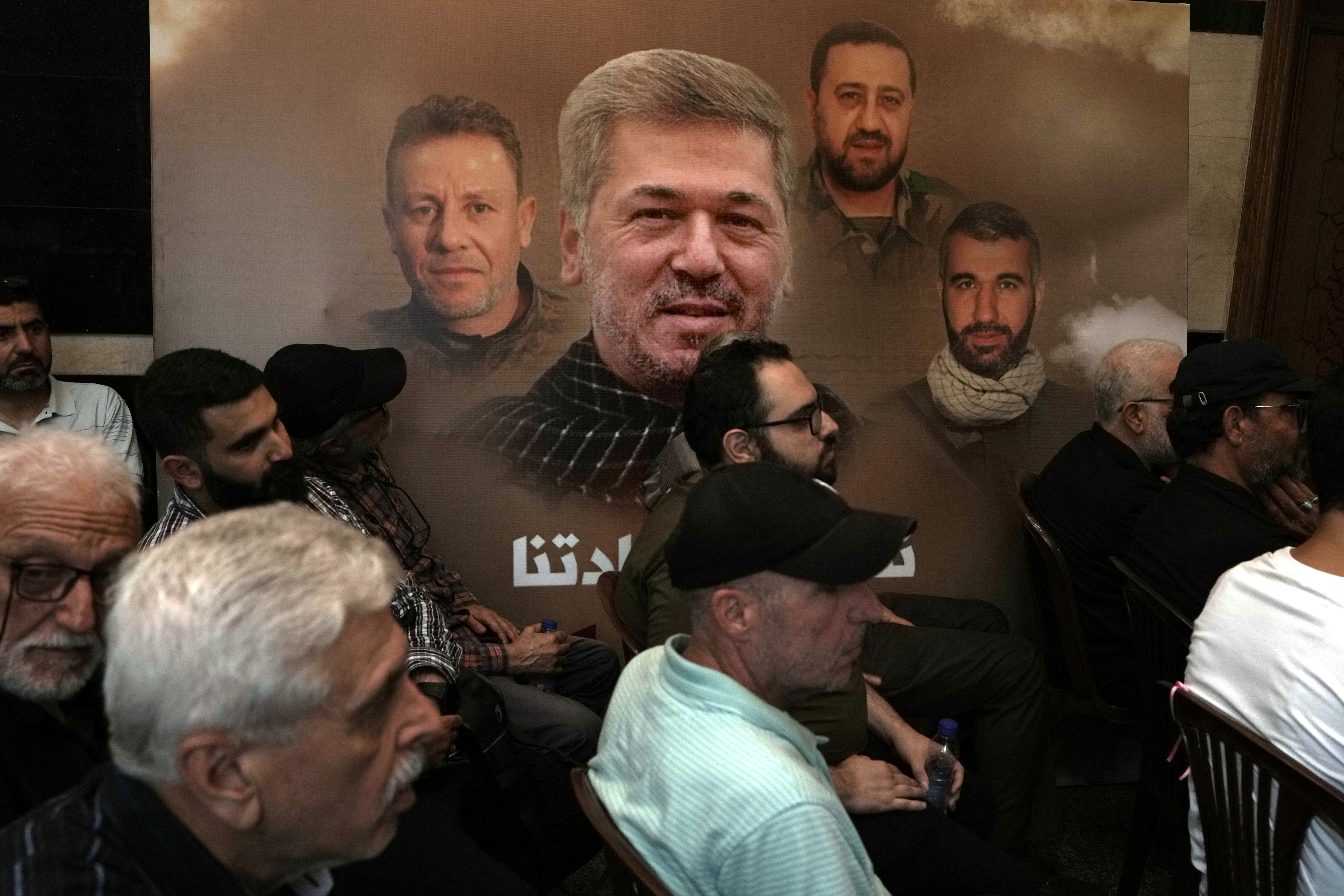 Hezbollah supporters watch a speech given by Sayyed Hassan Nasrallah during a ceremony to commemorate the death of senior Hezbollah commander Taleb Sami Abdullah. Photo / AP