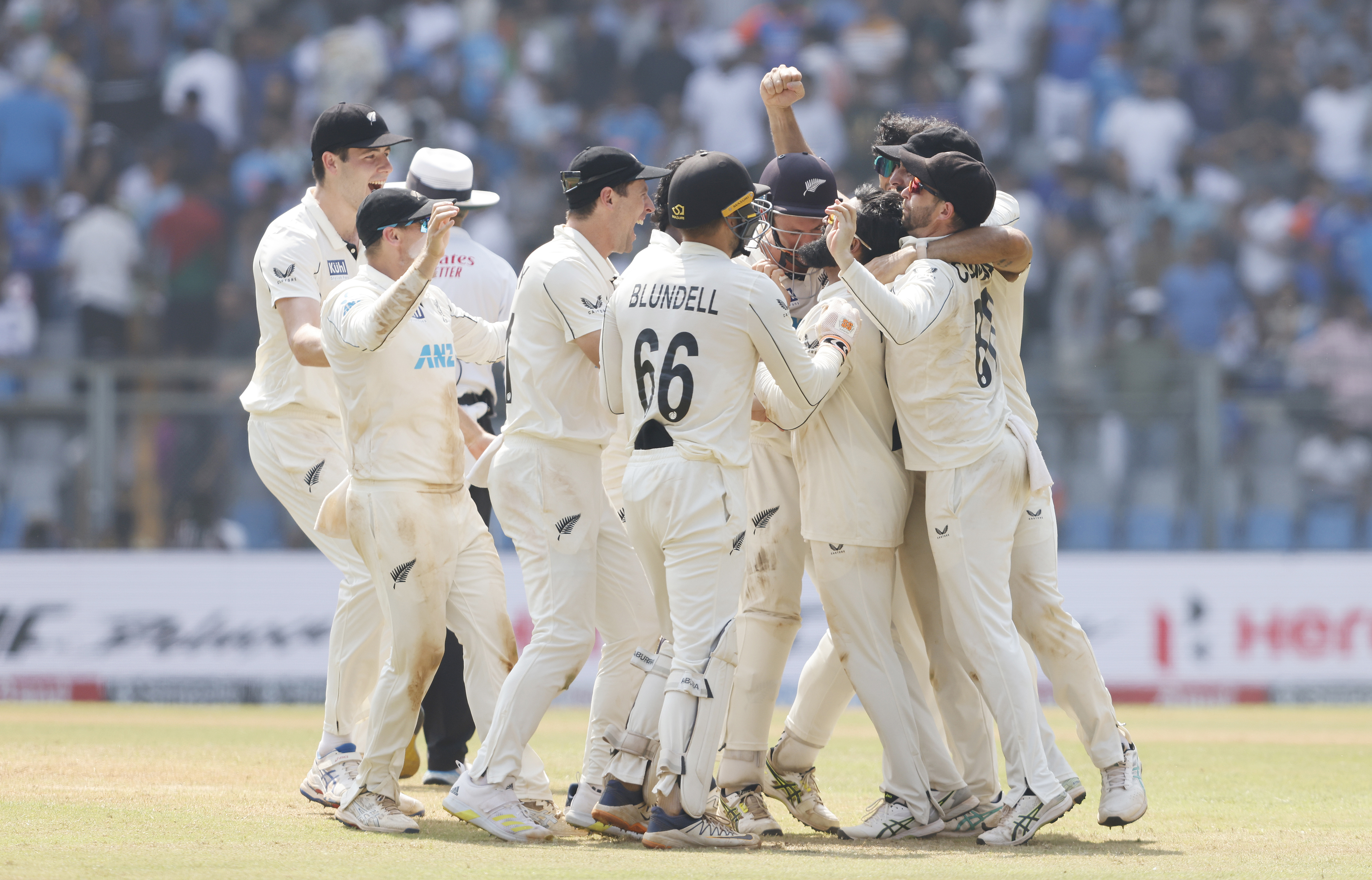 The Black Caps celebrate an improbable triumph over India. Photo / Photosport