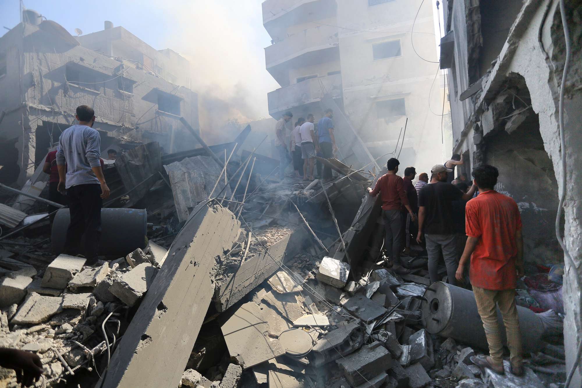Palestinians look for survivors after Israeli airstrikes in Gaza City. Photo / AP