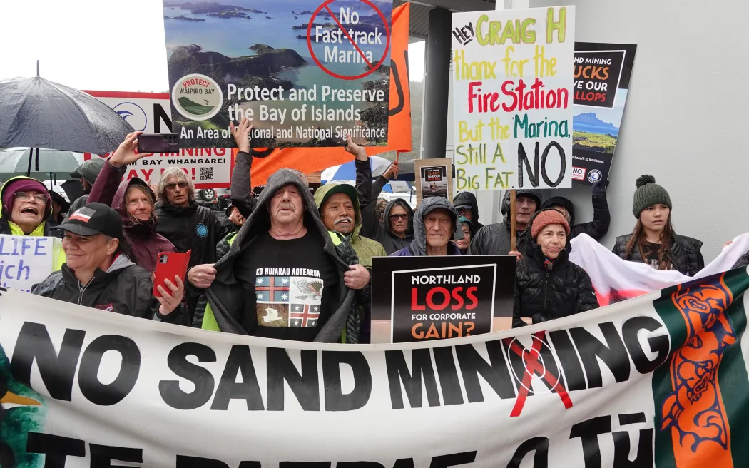 The protesters confronted Resources Minister Shane Jones. Photo / RNZ, Peter de Graaf