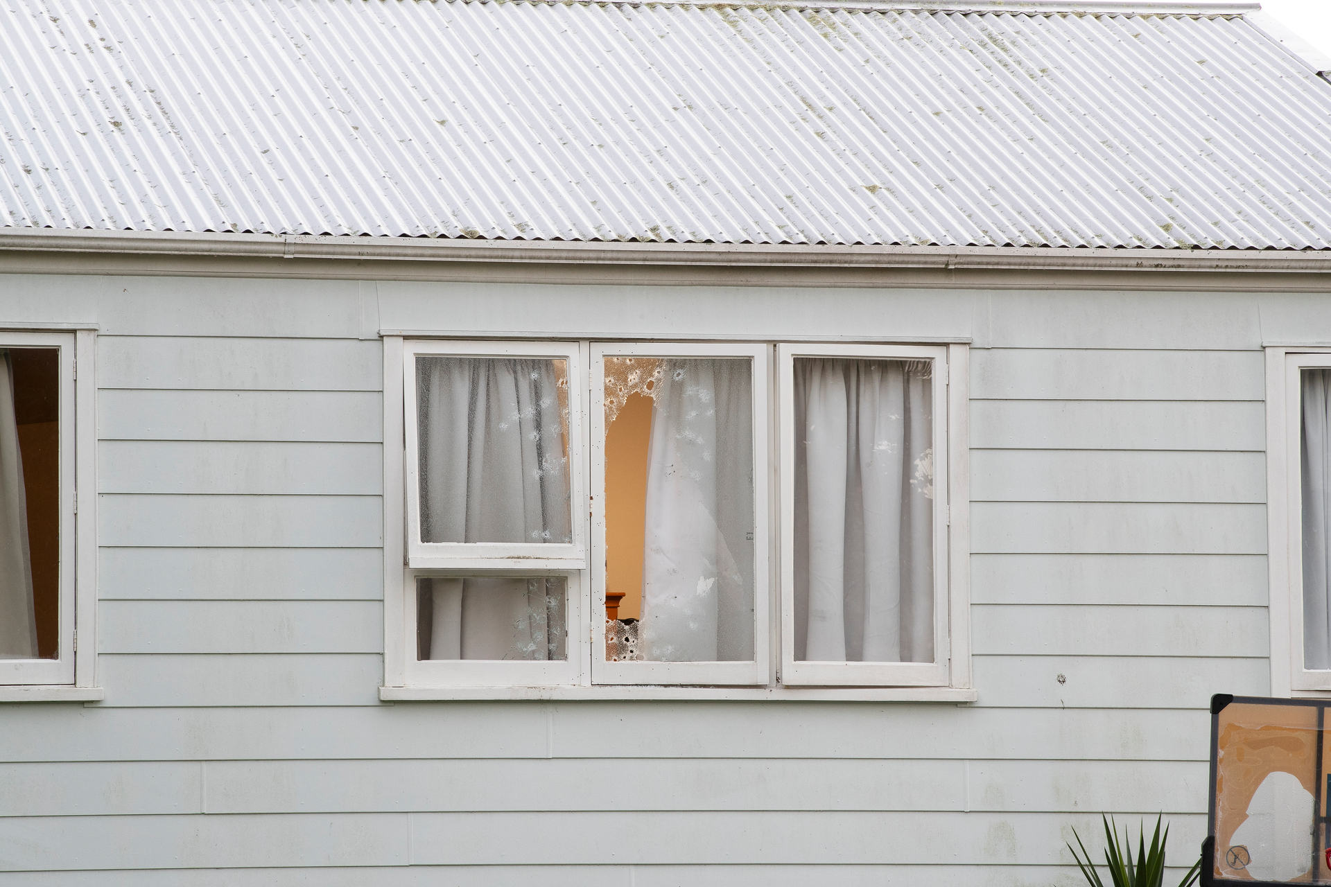 A Mirage Pl, Beach Haven, home was riddled with bullets in a suspected gang shooting last month, among many similar recent incidents in Auckland. Photo / Hayden Woodward