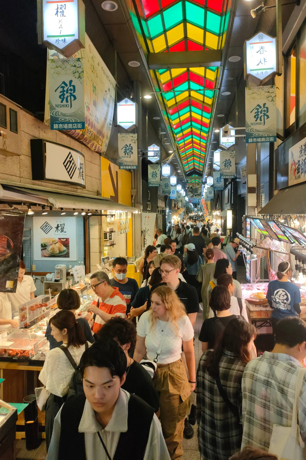 Tourists explore the busy Nishiki Market in downtown Kyoto. Photo / Jesse Mulligan