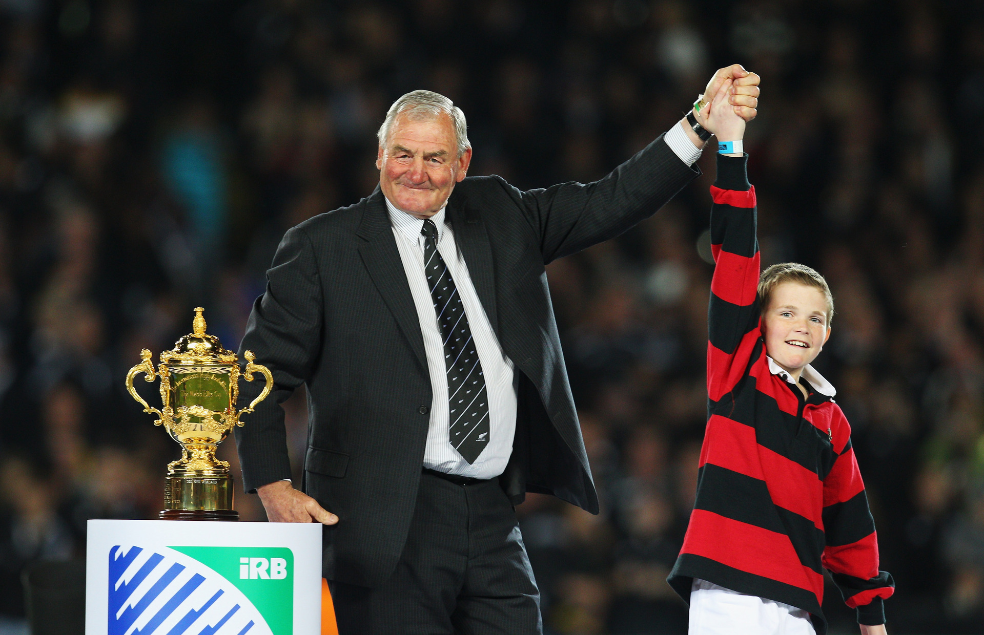 Sir Brian Lochore delivers the Webb Ellis Trophy during the 2011 Rugby World Cup final match between France and New Zealand. Photo / Getty