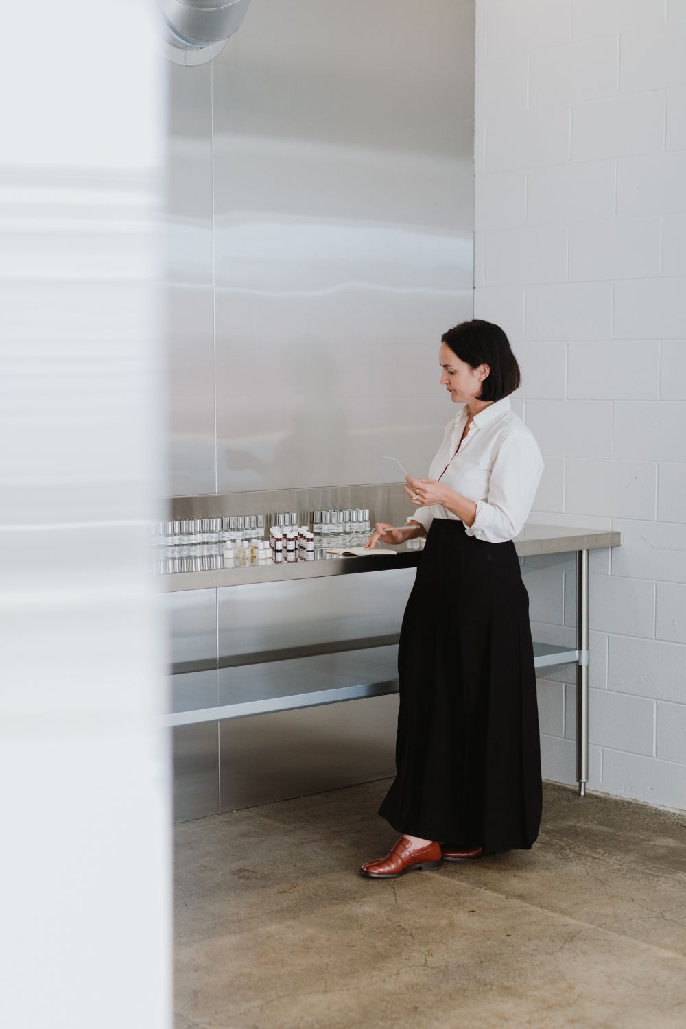 Frances samples scents inside the Abel Fabriek in Wellington.