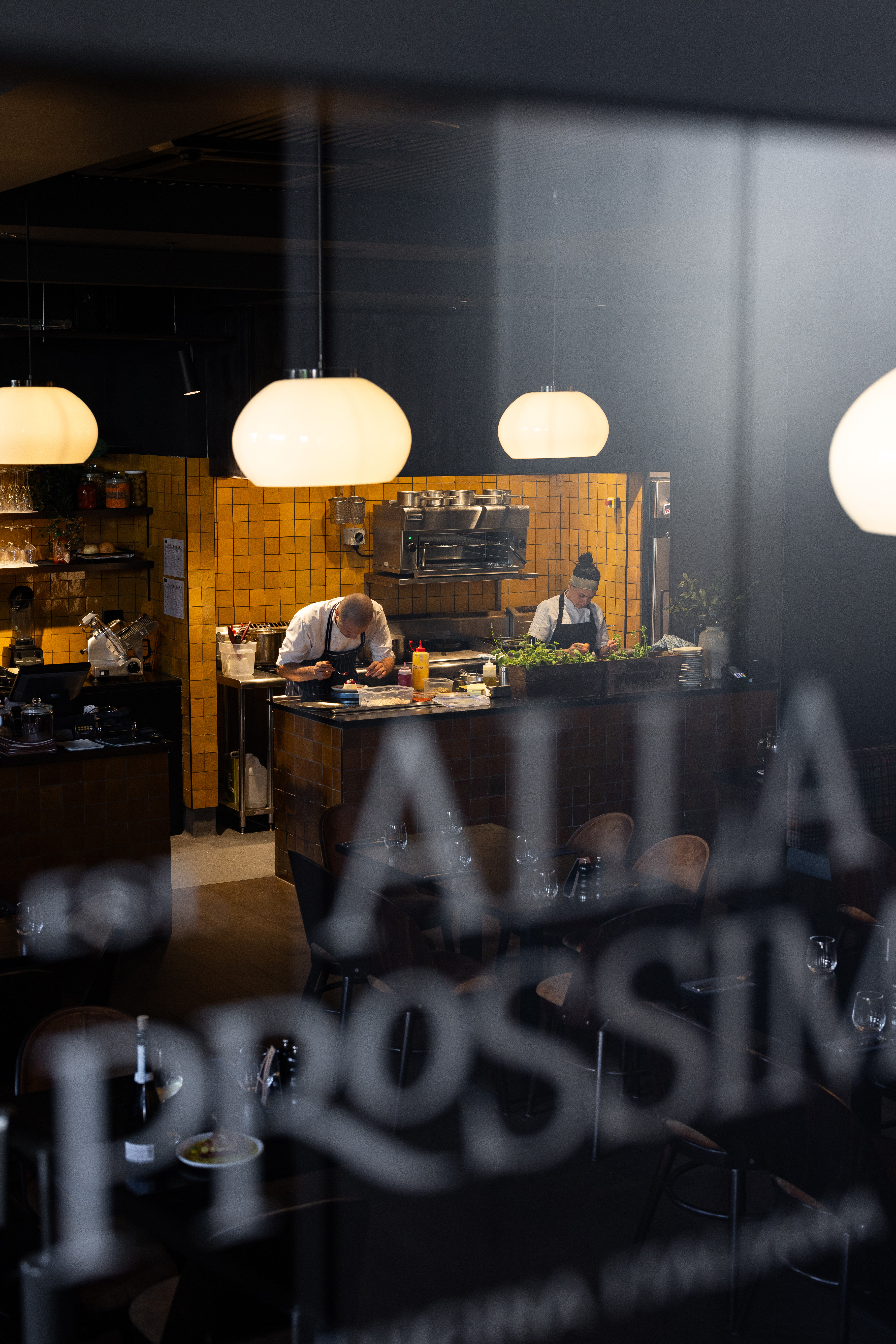 An open station within the restaurant shows chefs putting the final touches on dishes. Photo / Babiche Martens