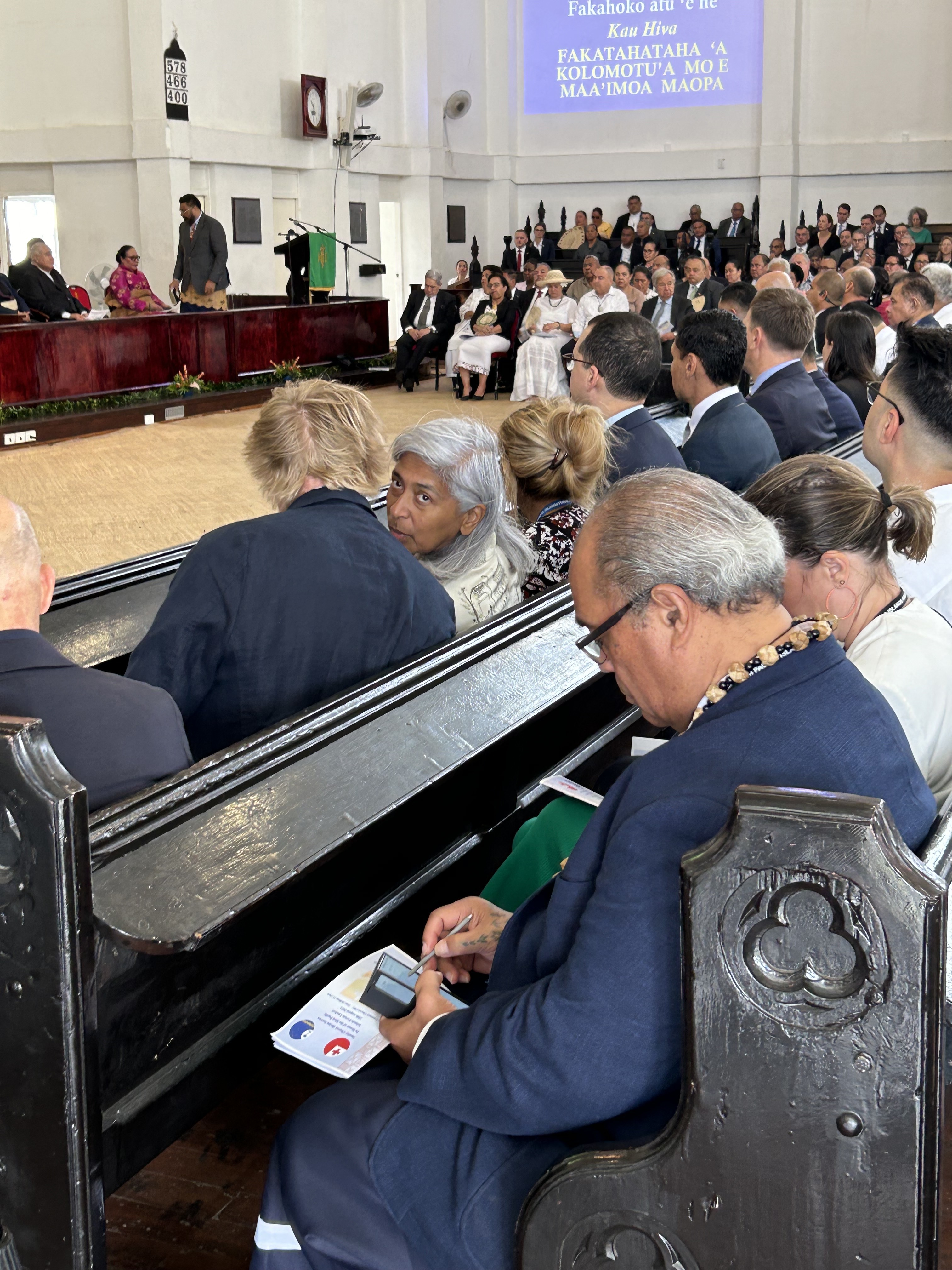 France's ambassador to the Pacific Véronique Roger-Lacan (centre) turns to speak to her neighbouring church-goer during the service in Tonga. Photo / Adam Pearse