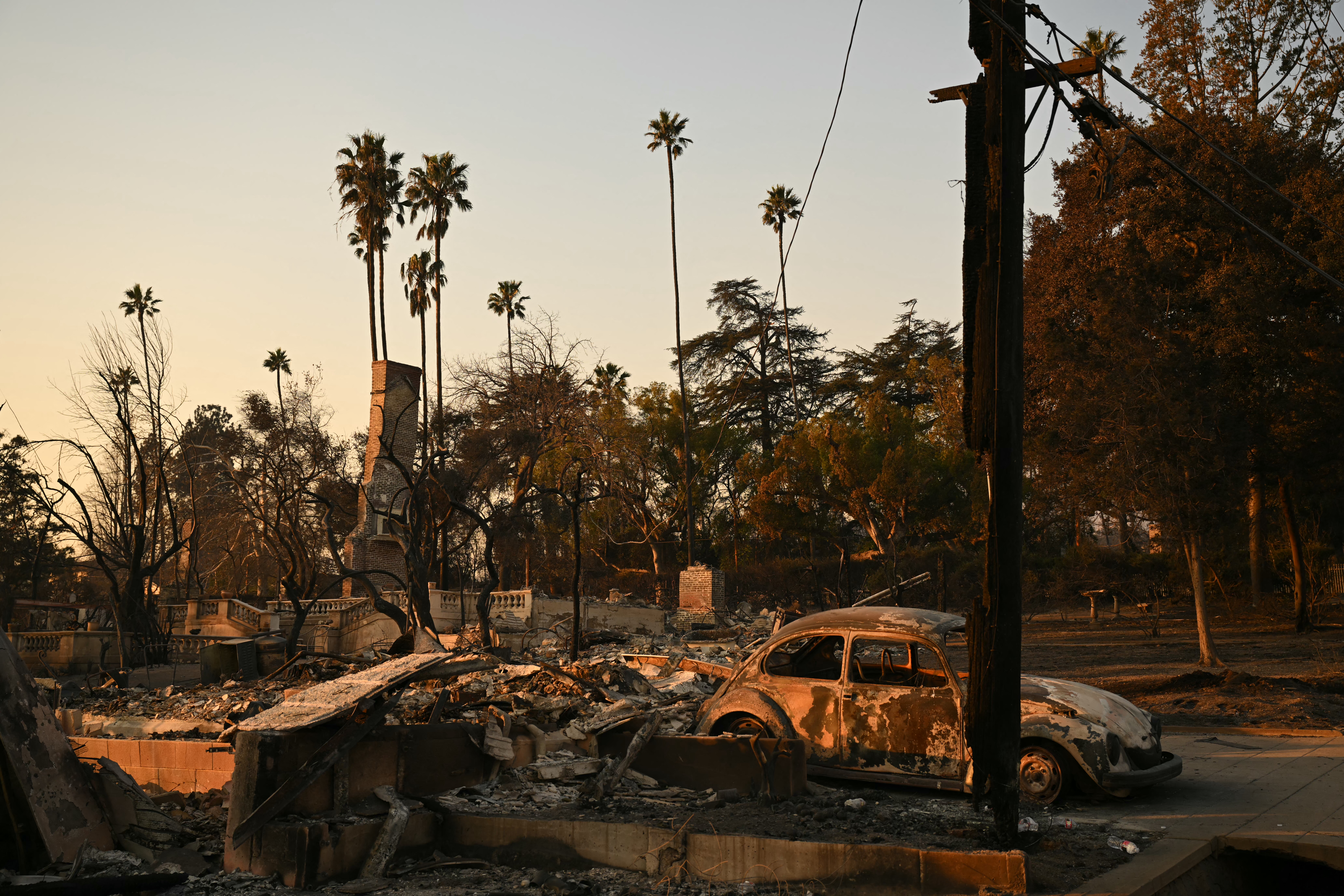 Burned-out cars and homes reduced to rubble by the Eaton fire. Photo / AFP