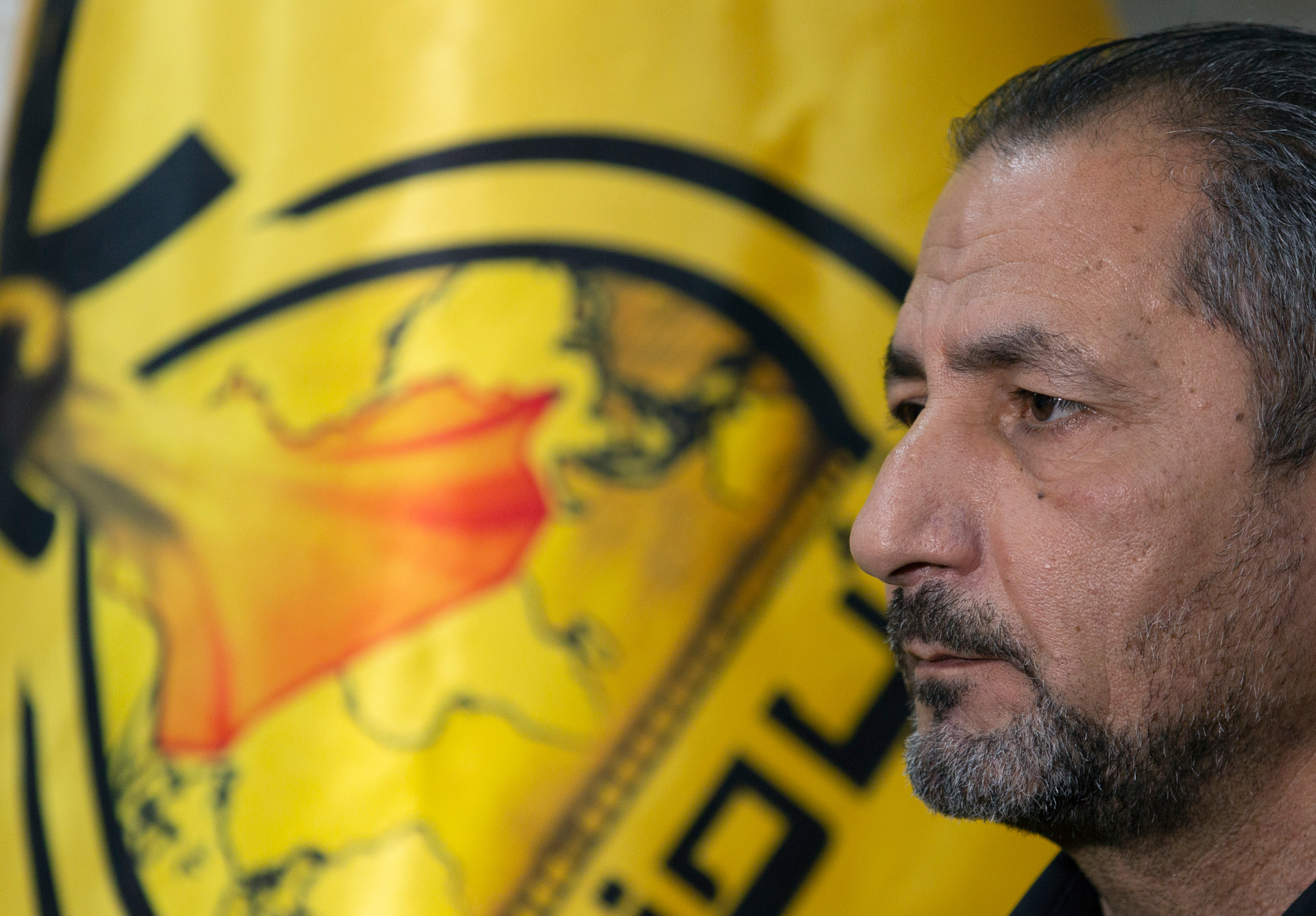 Mohammed Mohieh, the spokesman of Iraq's Iranian-backed Kataeb Hezbollah, or Hezbollah Brigades, gives an interview at his office, in Baghdad. Photo / AP