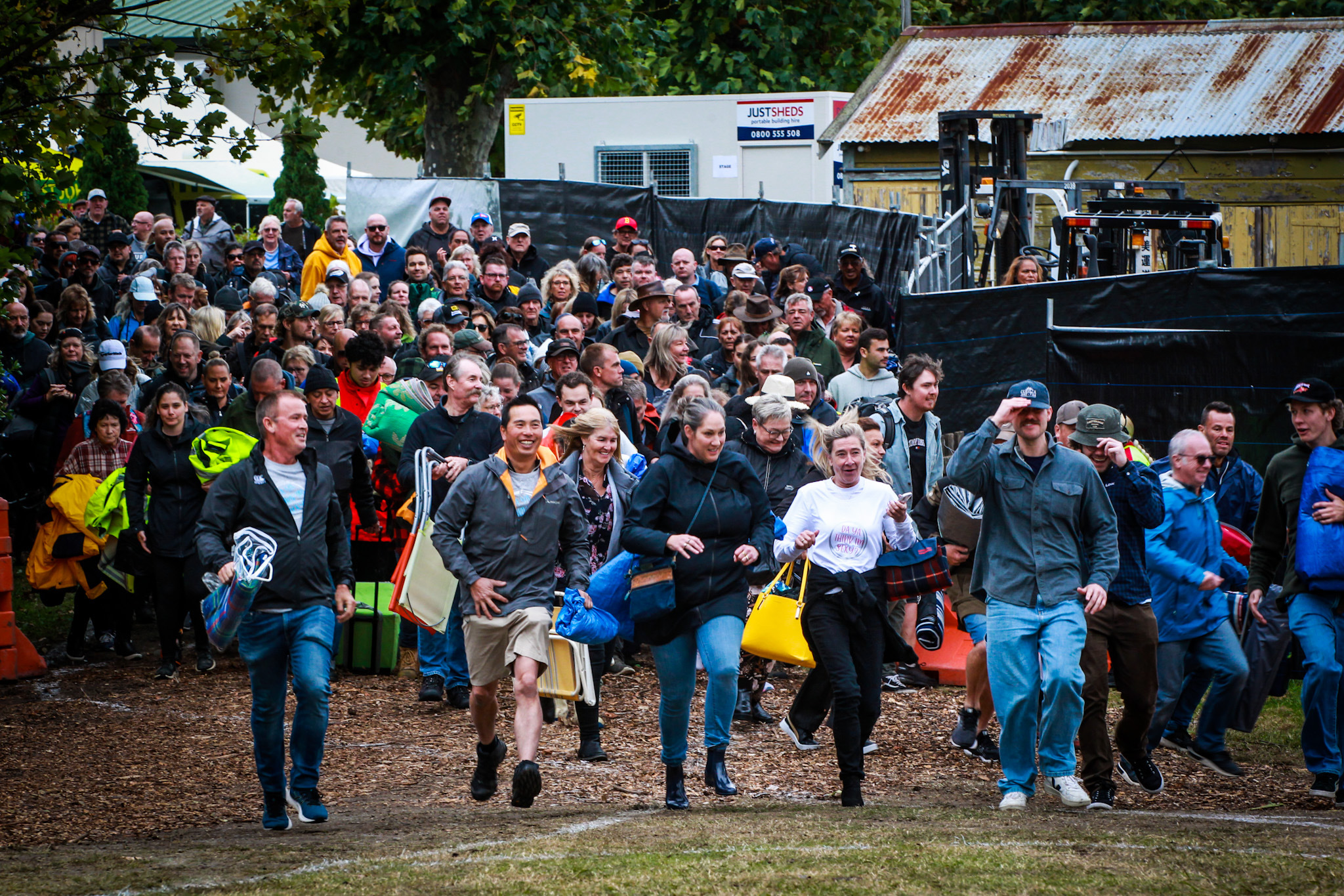 Punters make an early sprint for the best seats. Photo / Paul Taylor