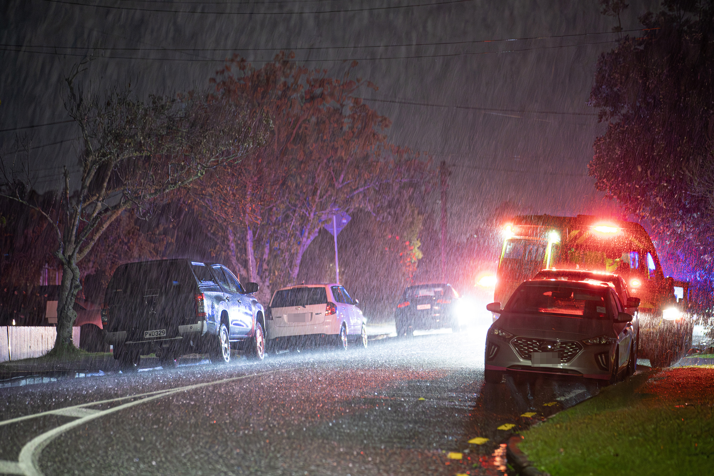 Emergency services responded to a two-vehicle crash in West Auckland. Photo / Hayden Woodward