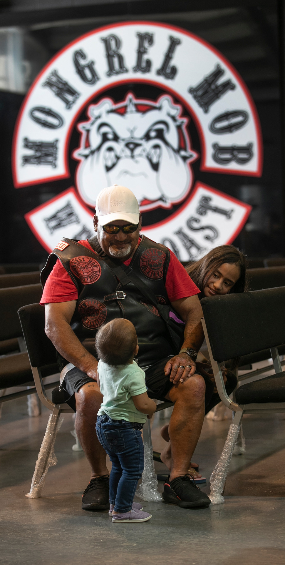 Waikato Mongrel Mob member Hemi Haimoana, entertains his grandchildren, Camelia Haimoana-Herbert, 1, (in green) and Mia Haimoana, 7. New Zealand Herald photograph / Alan Gibson