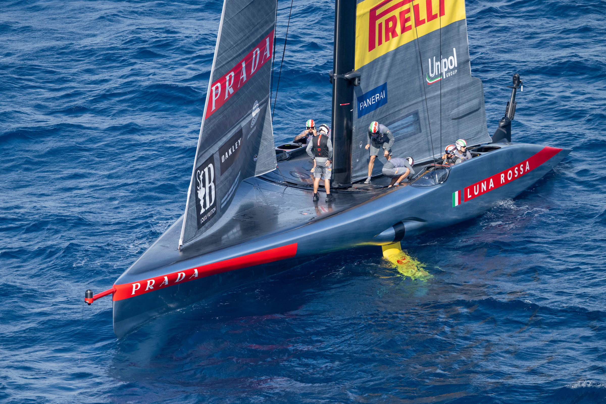 Luna Rossa Prada Pirelli assess the damage onboard after a big nosedive early in race seven of the Louis Vuitton Cup final. Photo / Ricardo Pinto, America's Cup
