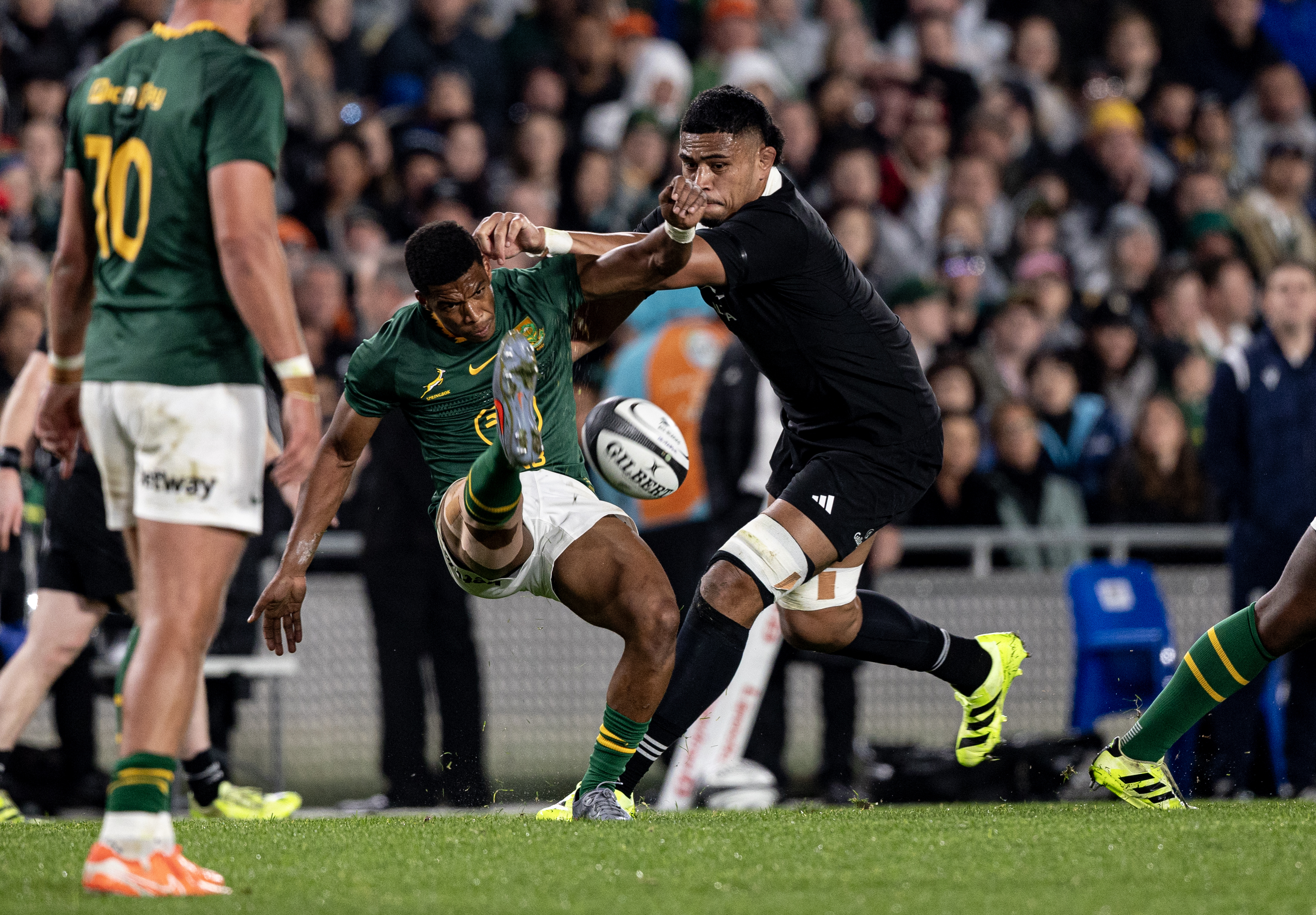 All Blacks lock Tupou Vaa'i (right) and Springboks halfback Grant Williams in action at Eden Park. Photo / Dean Purcell