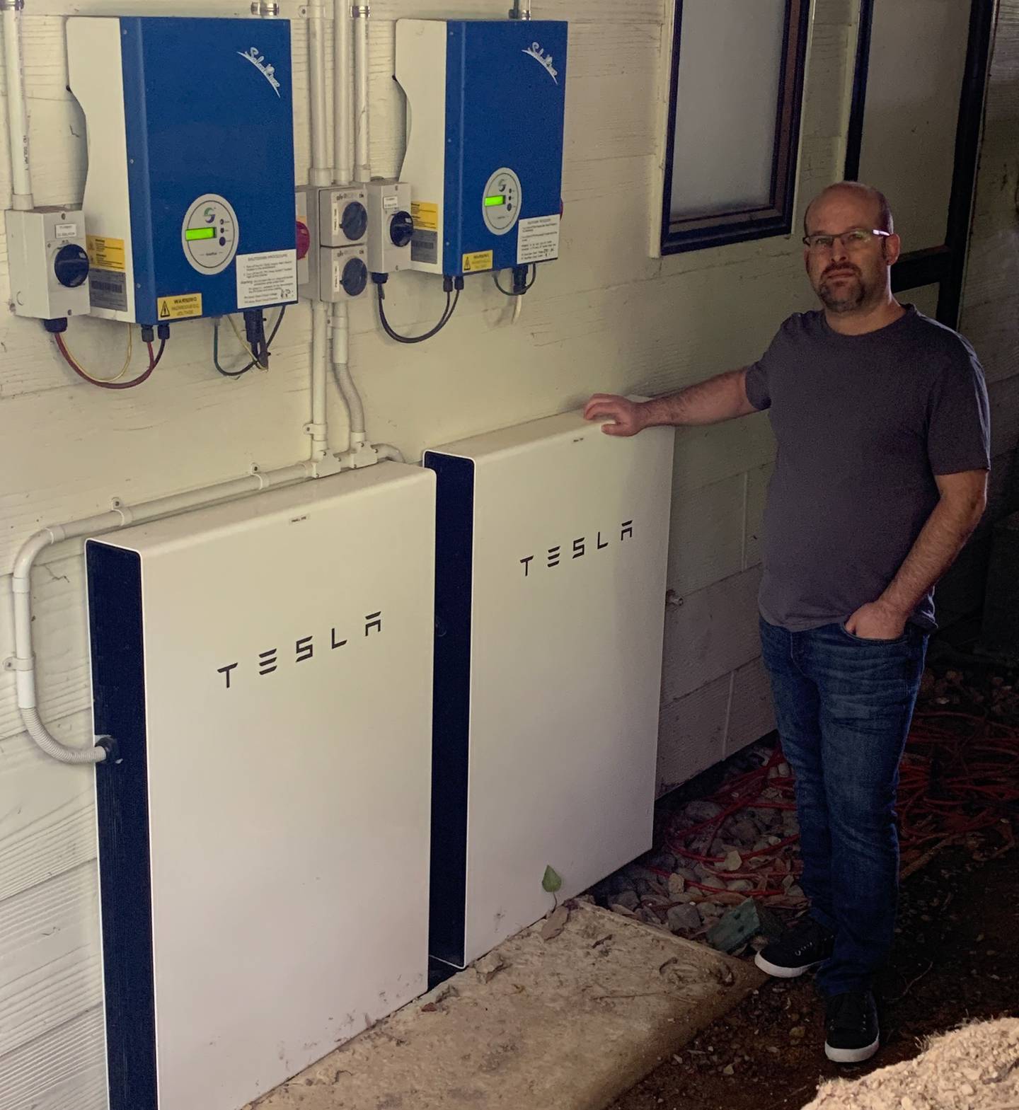 Stokes Valley man Tim Philips with his twin Tesla Powerwall 2 setup,