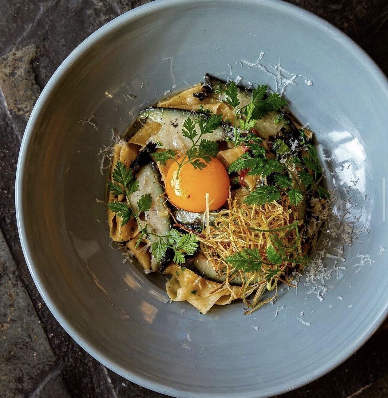 Pāua pappardelle, confit yolk, kombu soy and crispy leeks at Aosta. Photo /  Isabella Rubie
