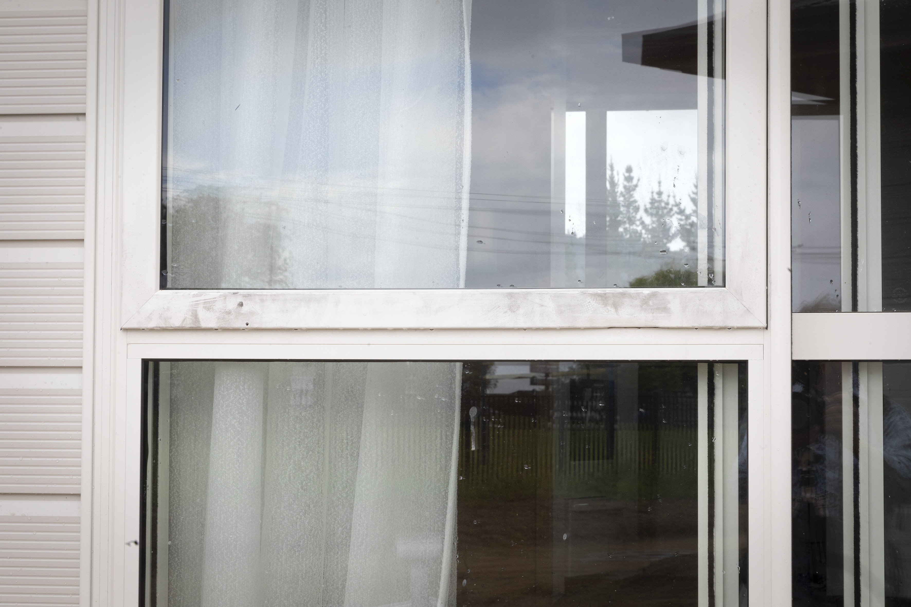 Damage to the windows at the papakāinga development. Photo / Andrew Warner