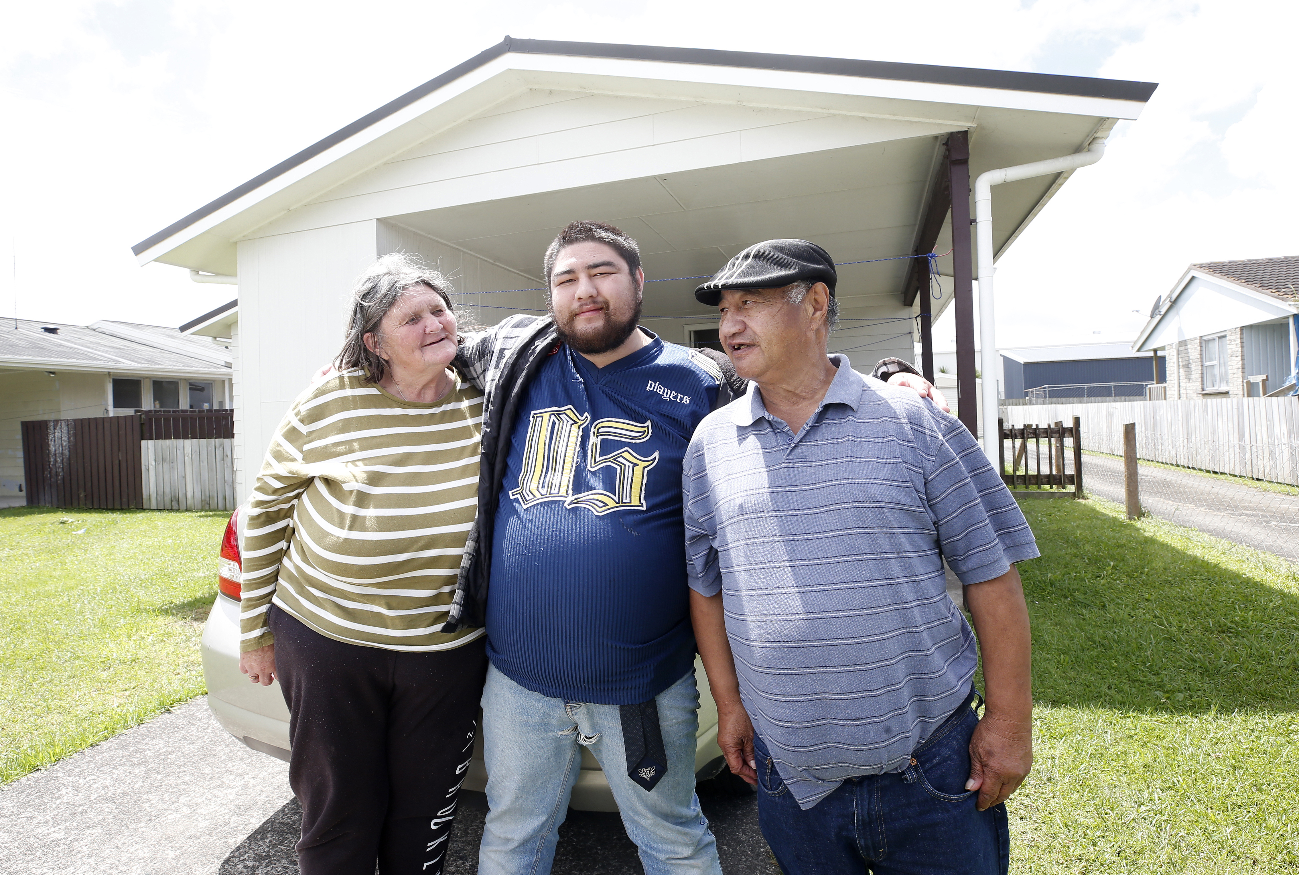 Dianne Baker, Matua Baker Senior, and son Harry Baker on Finlayson Park Ave were evacuated on Tuesday. Photo / Michael Cunningham