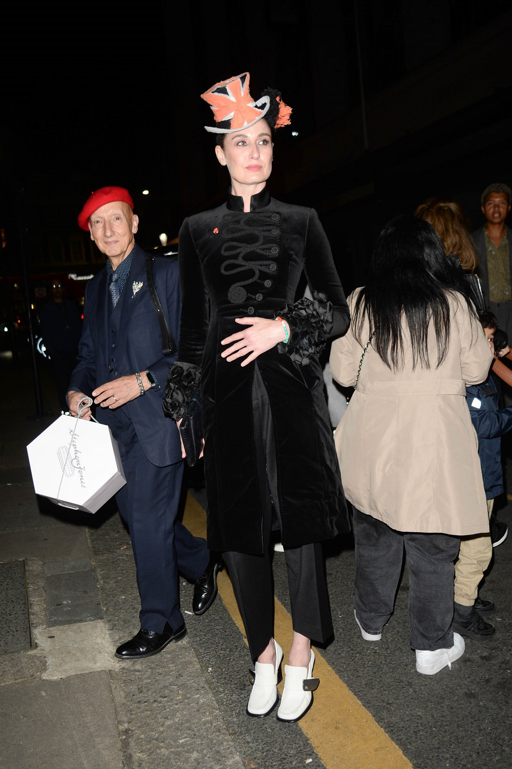 Milliner Stephen Jones and supermodel Erin O'Connor outside the LFW40 Icons Party. Photo / Getty Images