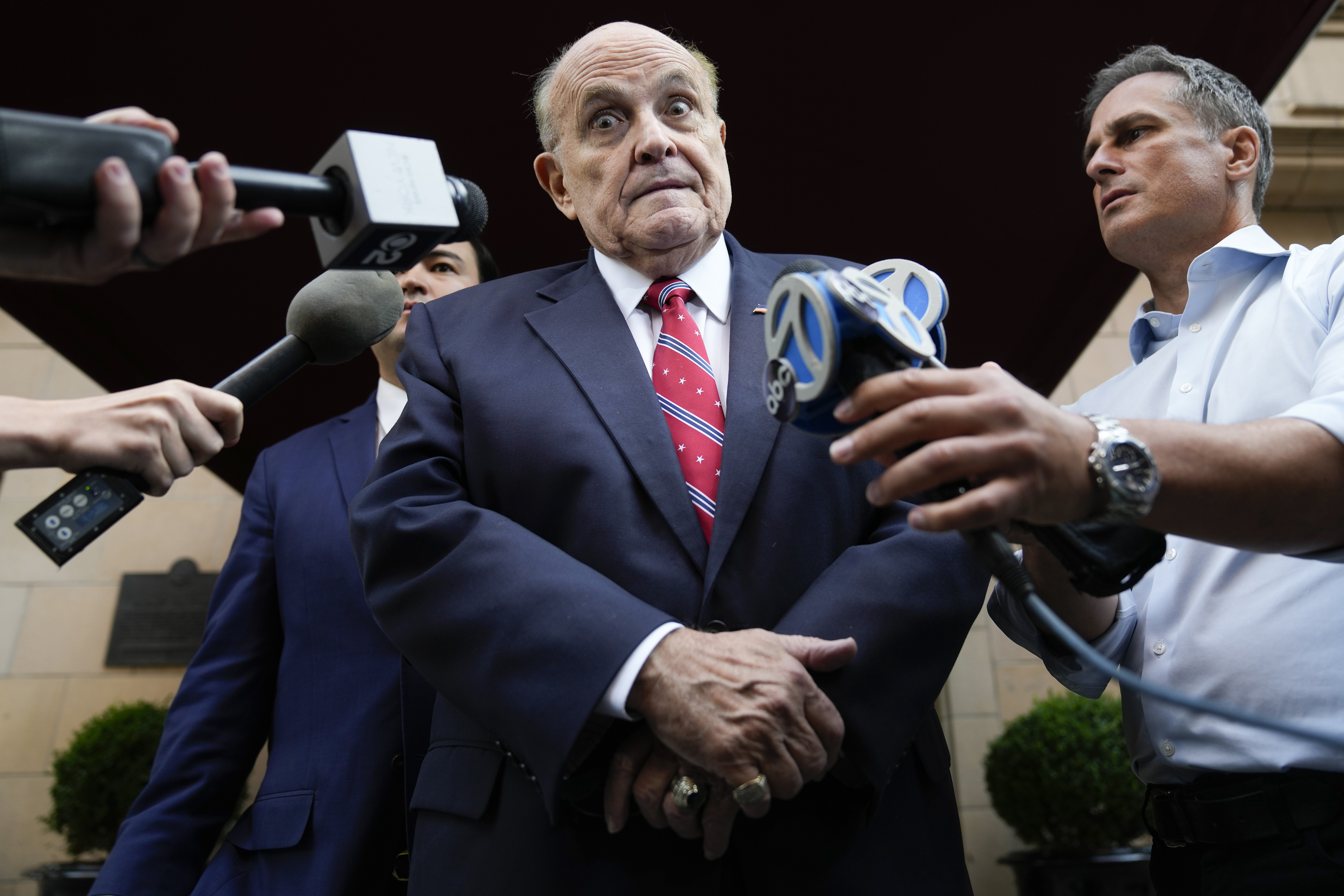 Former Mayor of New York Rudy Giuliani speaks to reporters as he leaves his apartment building in New York earlier this year. Photo / AP