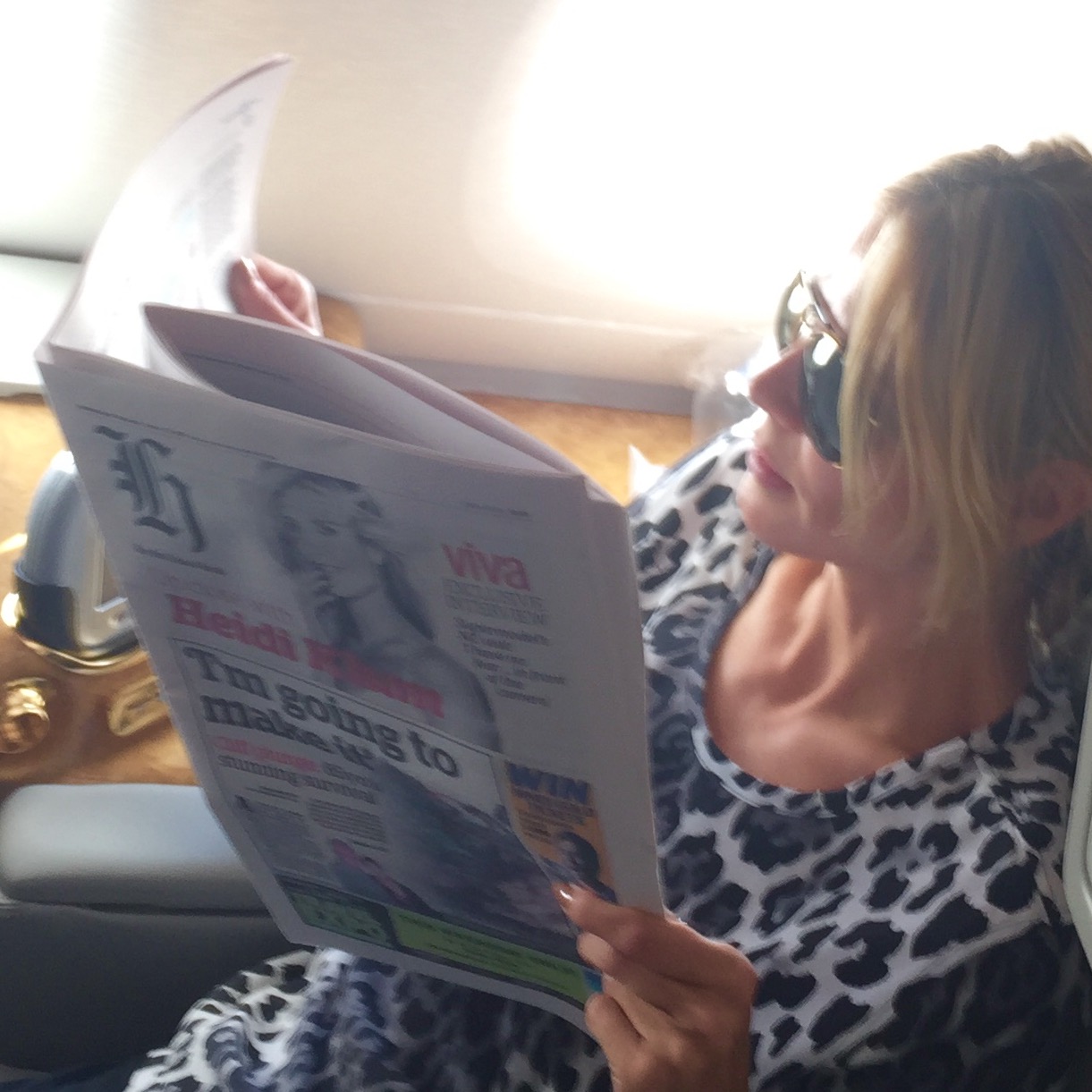 Heidi Klum tweeted this photo of her reading the Herald on her way to New Zealand. Photo / Supplied