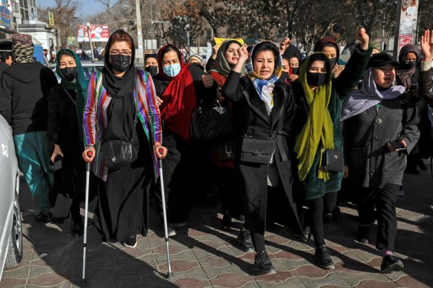 Afghan women chant slogans during a protest against the ban on university education for women, in Kabul, Afghanistan, yesterday. Photo / AP